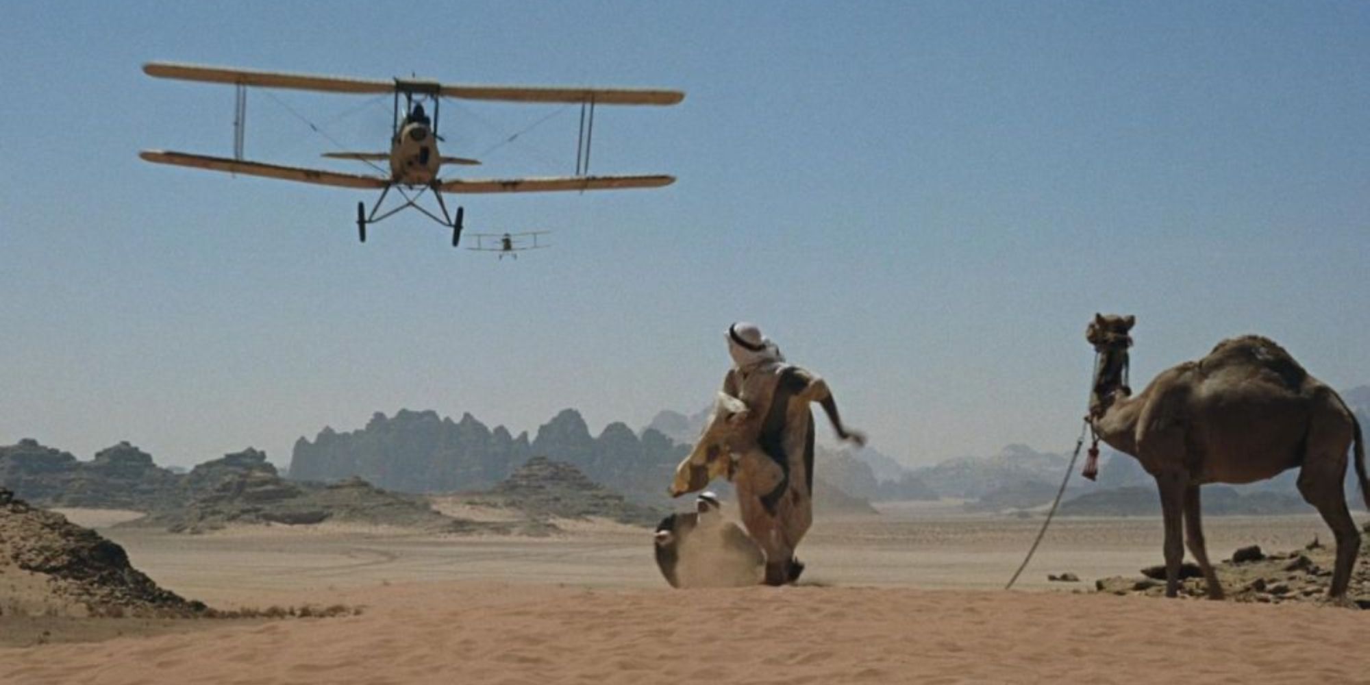 A plane flying towards Lawrence and his camel in Lawrence of Arabia (1962)