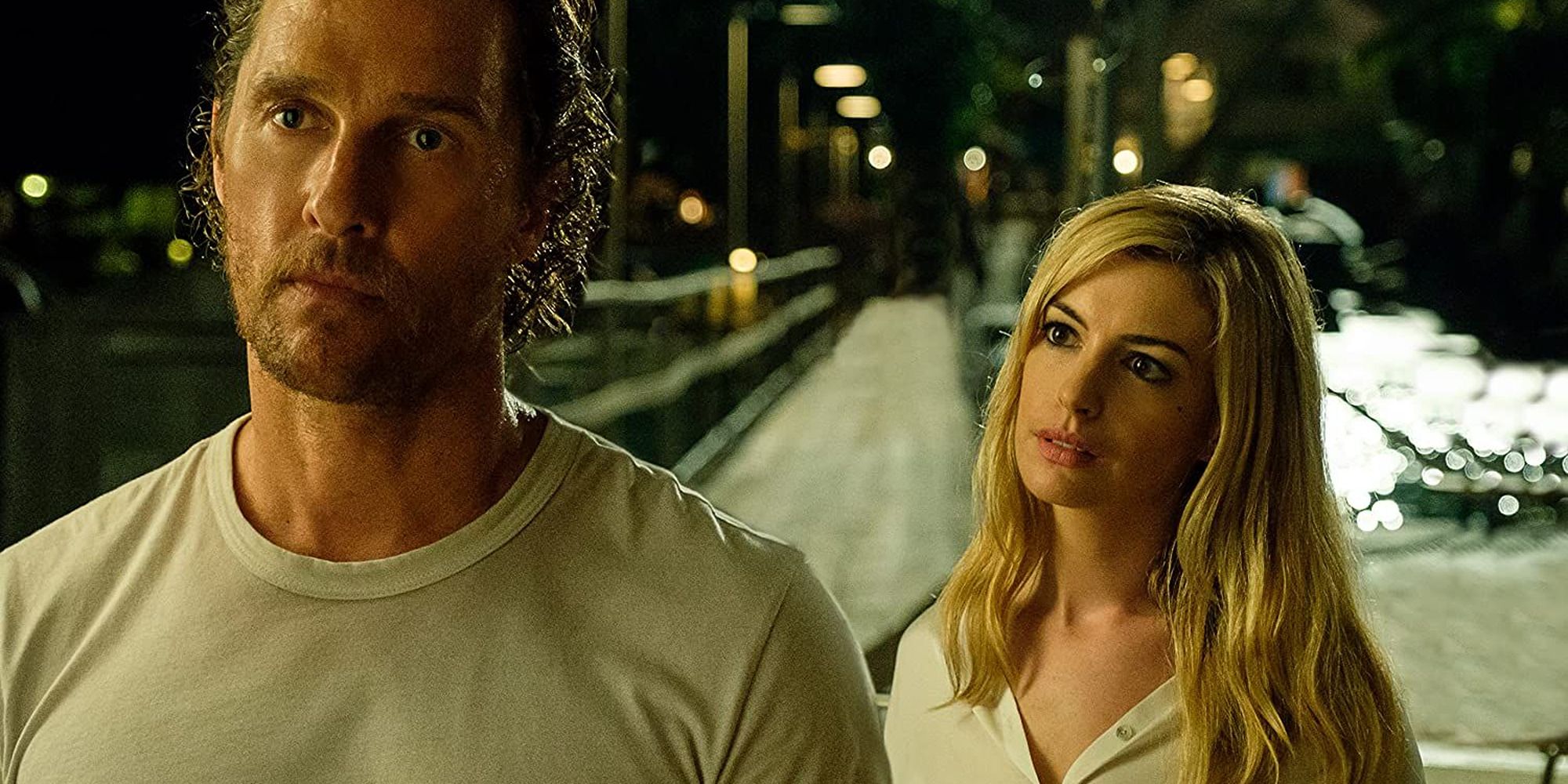 Anne Hathaway looking at Matthew McConaughey from behind in Serenity