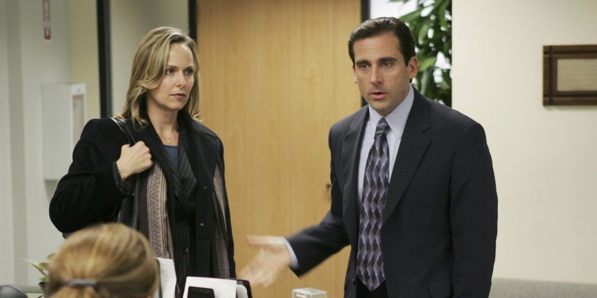 Michael Scott and Jan Levinson in The Office at reception, Michael is waving his hand