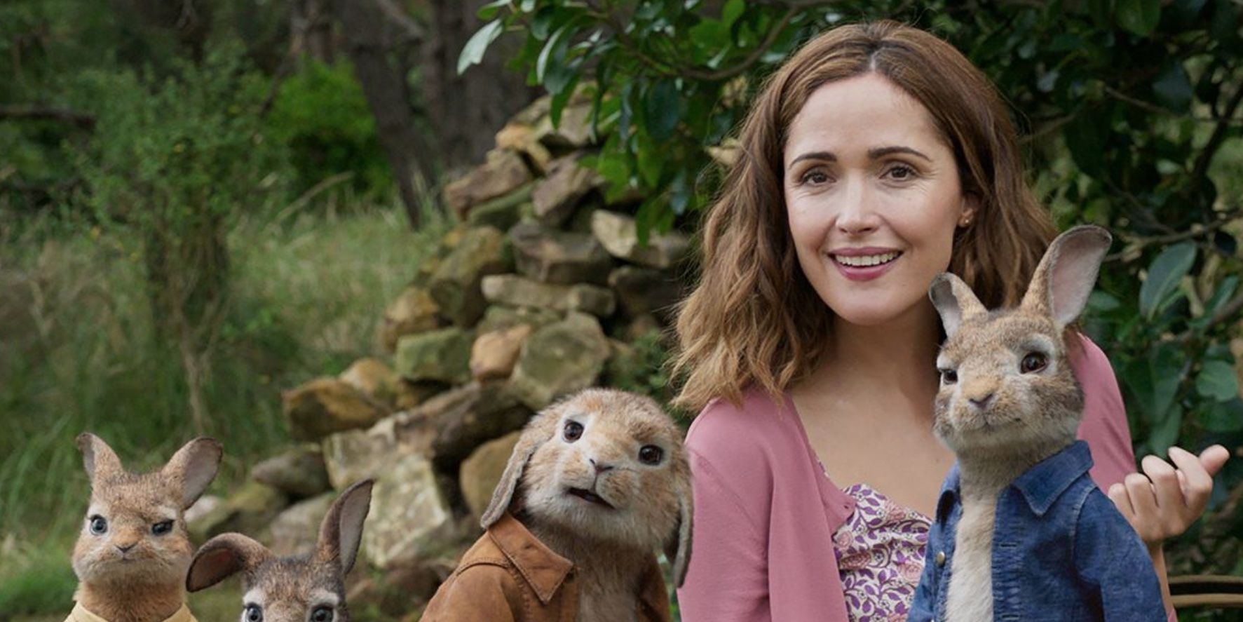 Rose Byrne sitting with rabbits in 'Peter Rabbit'