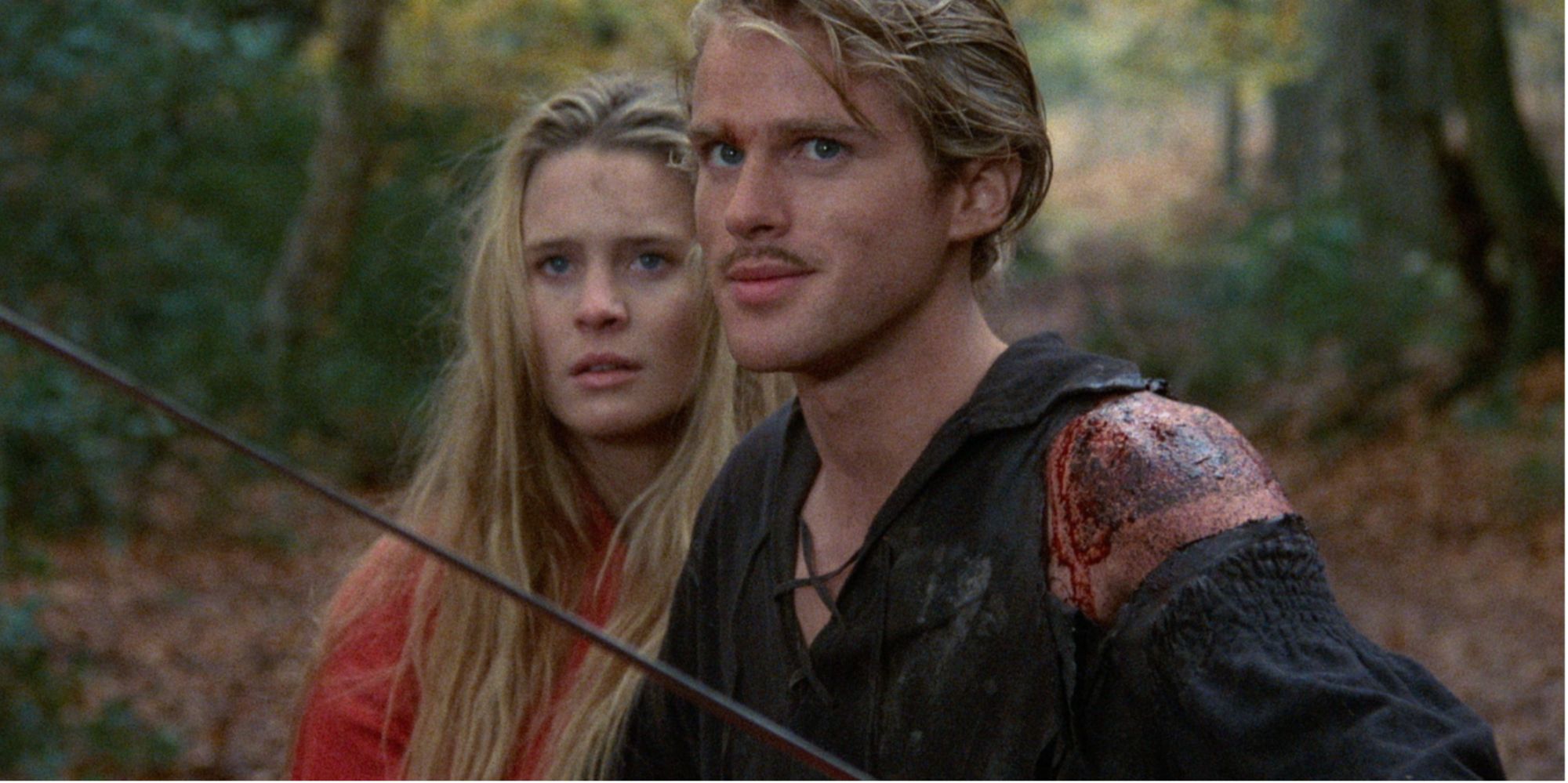 Westley (Cary Elwes) defending Buttercup (Robin Wright) with a sword  in 'The Princess Bride'
