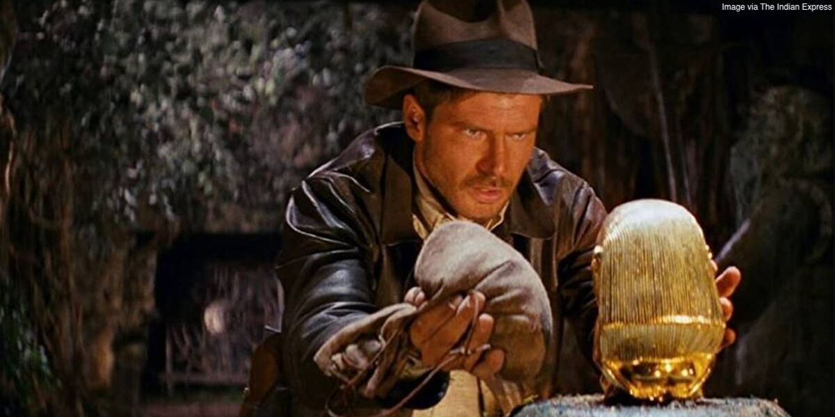 Indiana Jones about to grab the golden idol in Raiders of the Lost Ark