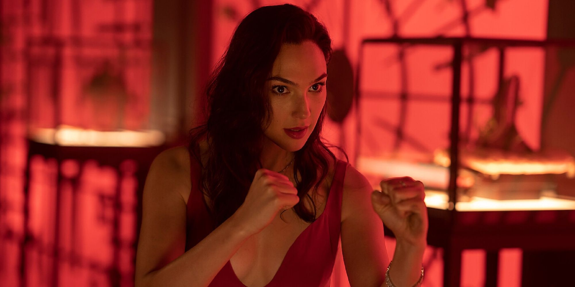 Gal Gadot as Sarah Black with her arms in a boxing position in Red Notice.