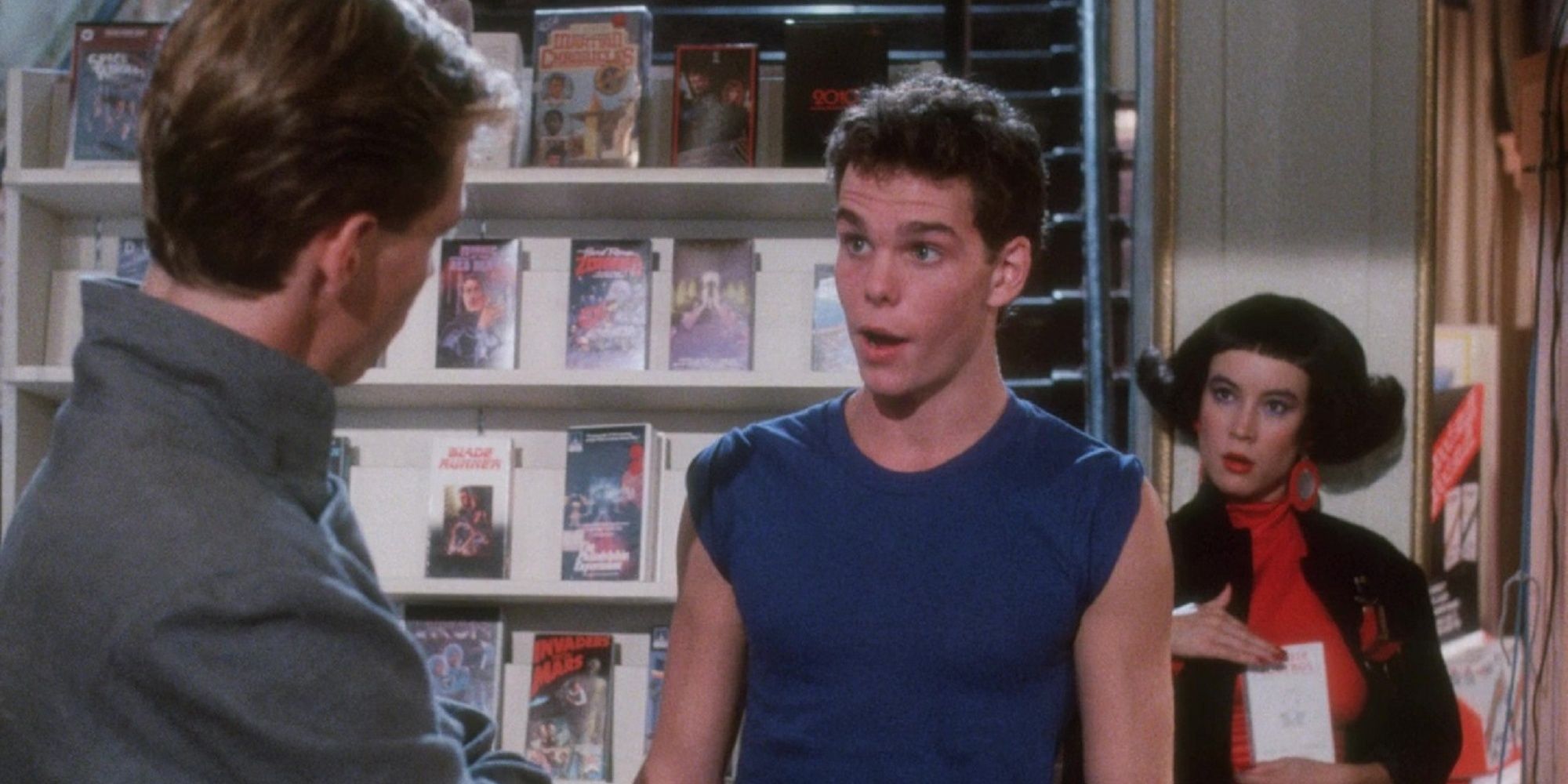 Kevin Dillon and Jennifer Tilly in the video store in Remote Control.