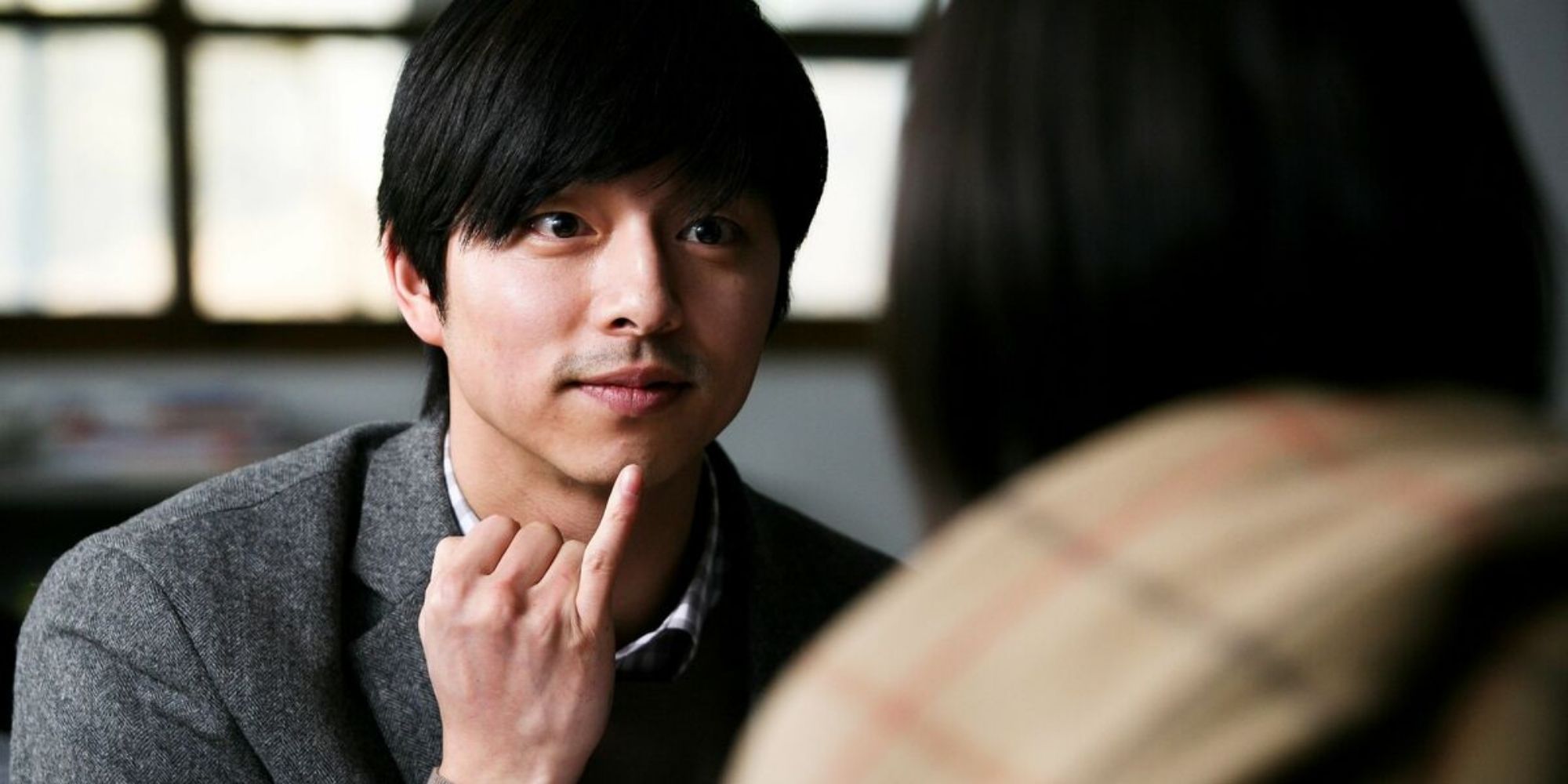 A young man doing sign language in the film Silenced