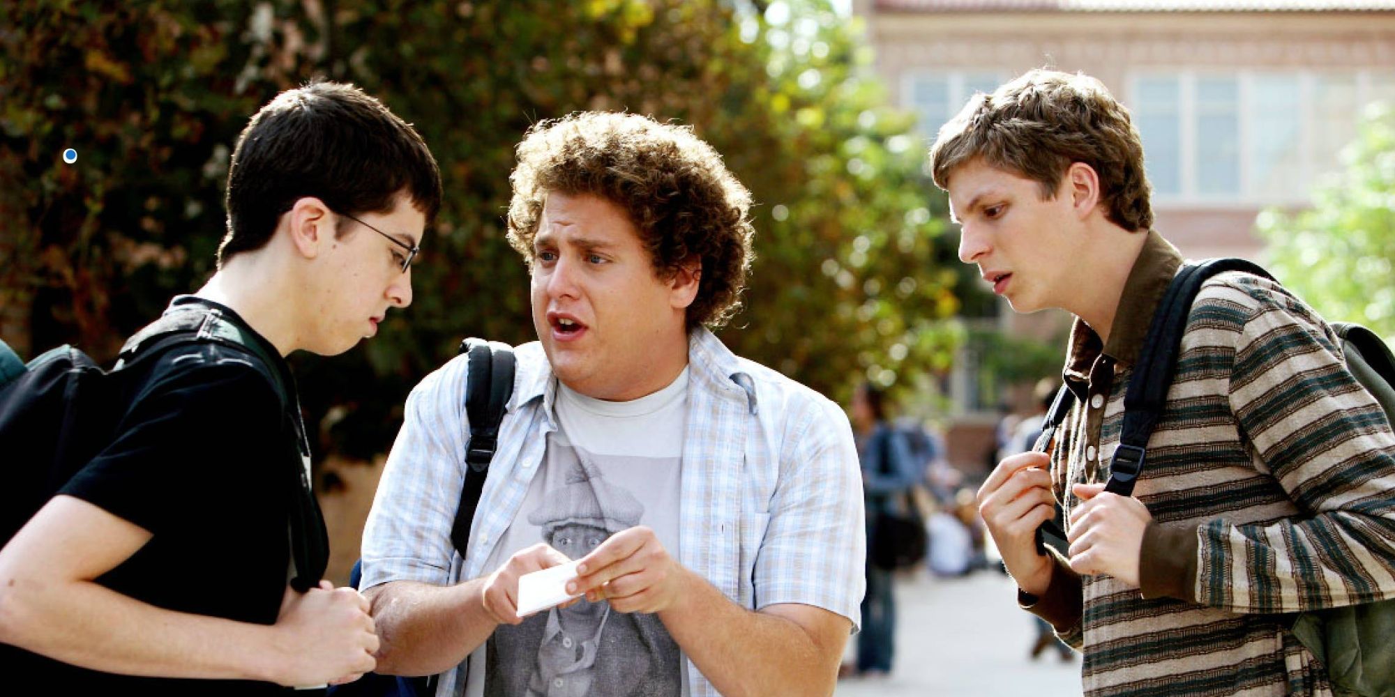 Three teenage boys argue about McLovin's fake ID after school. 