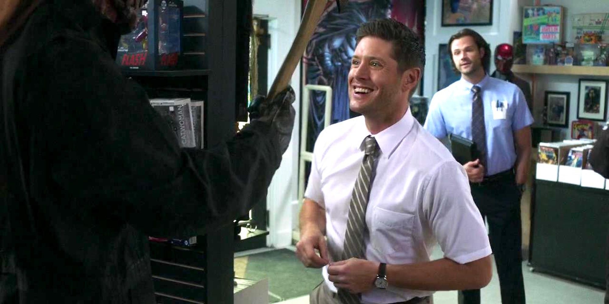 Supernatural sam and dean smiling at the hatchetman figure