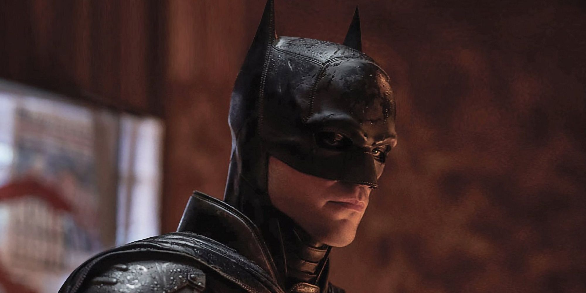 Robert Pattinson as Batman looking intently in The Batman.