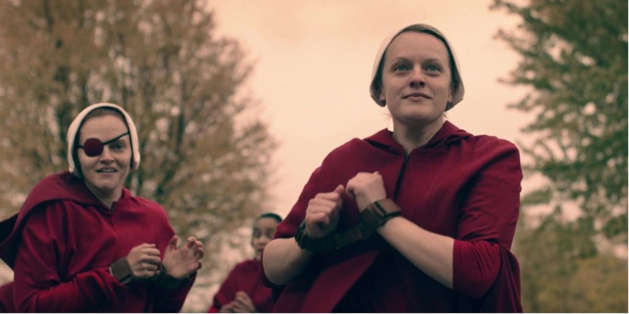 June, Janine, and other handmaids run away with their hands cuffed
