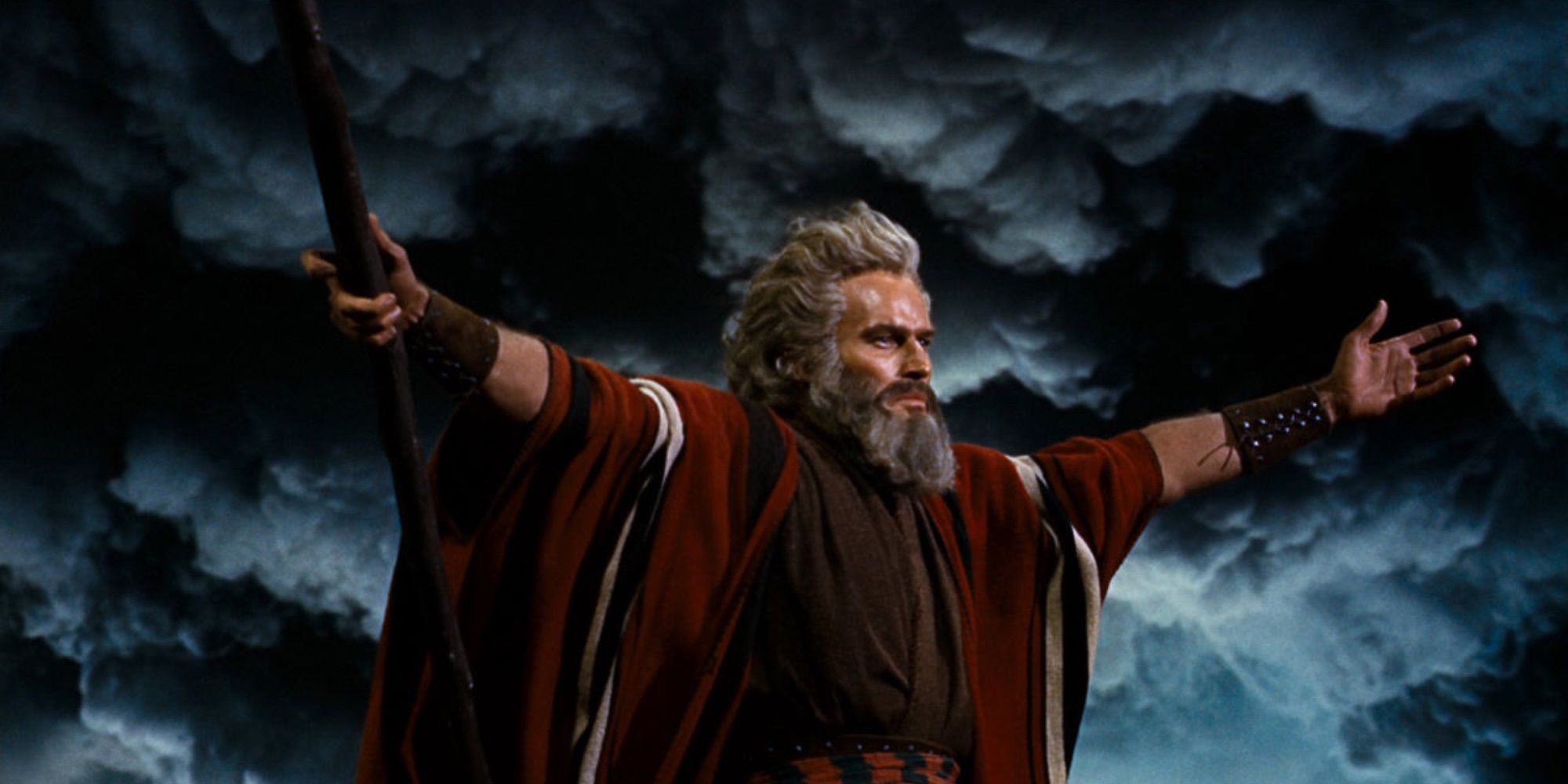 Moses (Charlton Heston) with his arms raised in 'The Ten Commandments.'