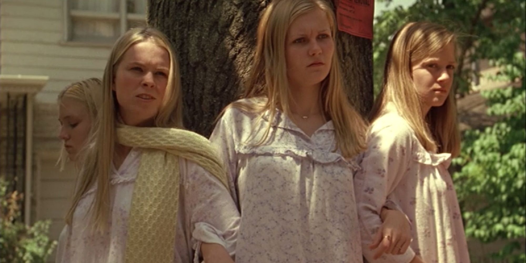The Lisbon sisters together around a tree in The Virgin Suicides.