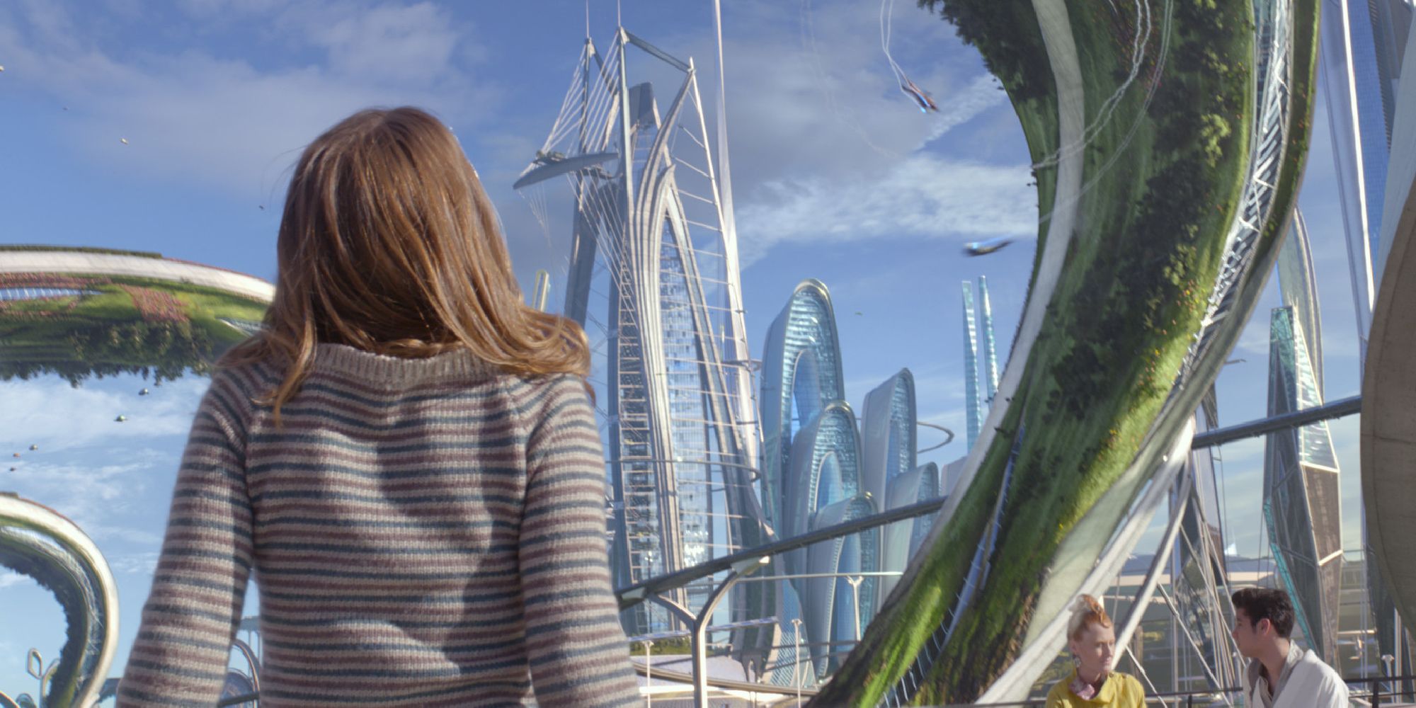 In Tomorrowland, a young girl looks up a a futuristic city that appears out of thin air