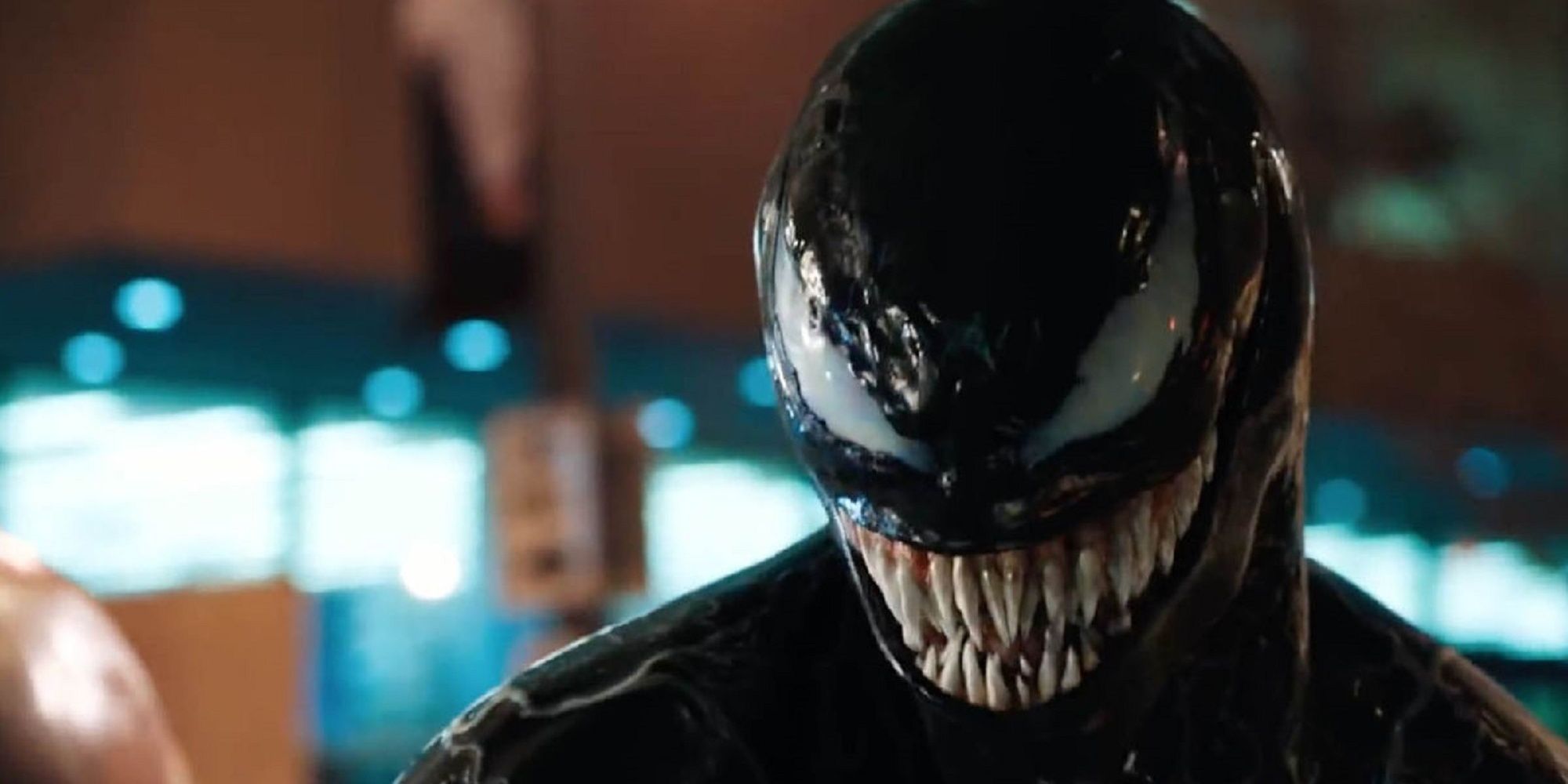 Venom smiling at the camera in Venom.