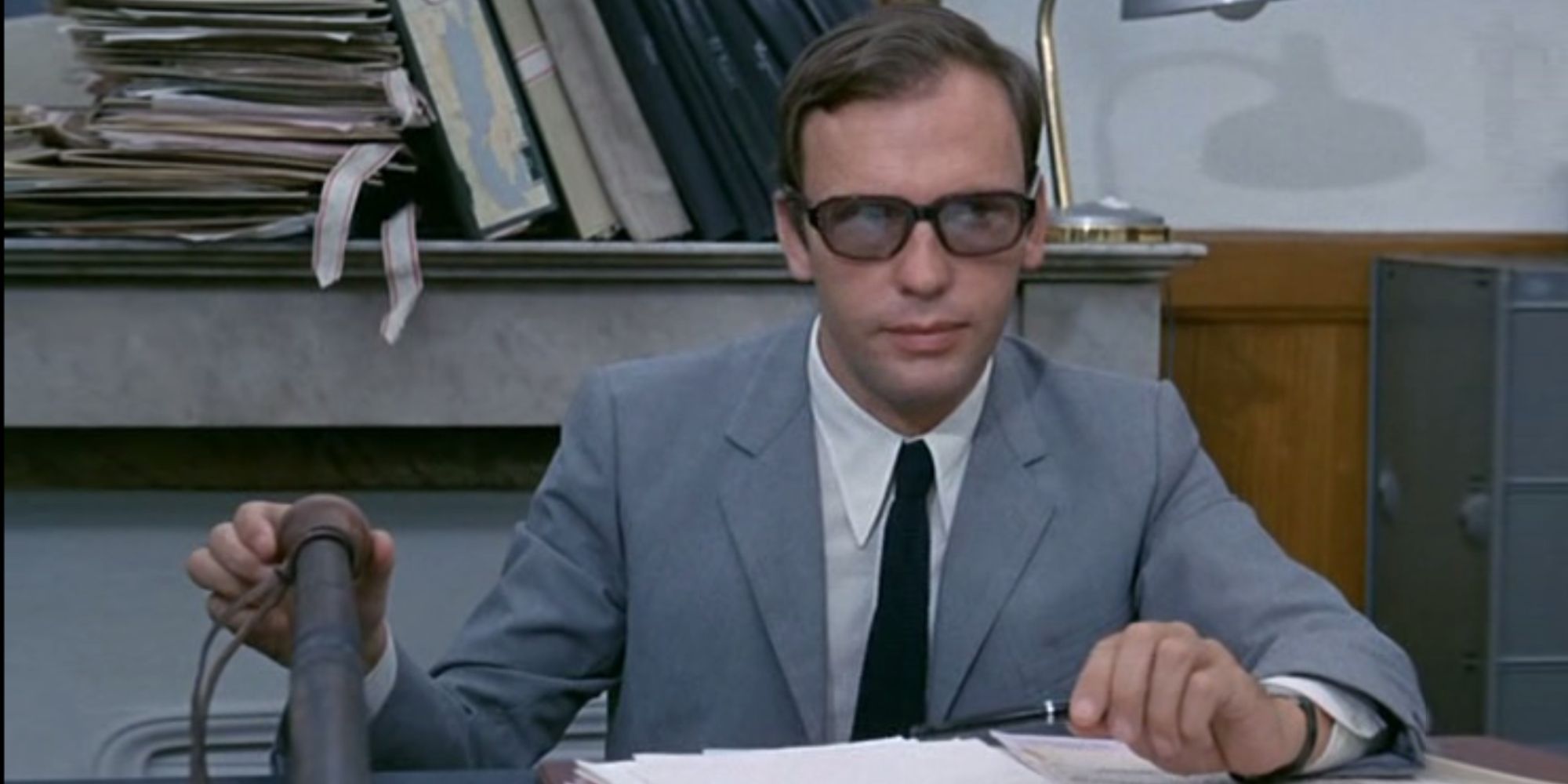 Jean-Louis Trintignant Sitting at a Table in Z (1969)