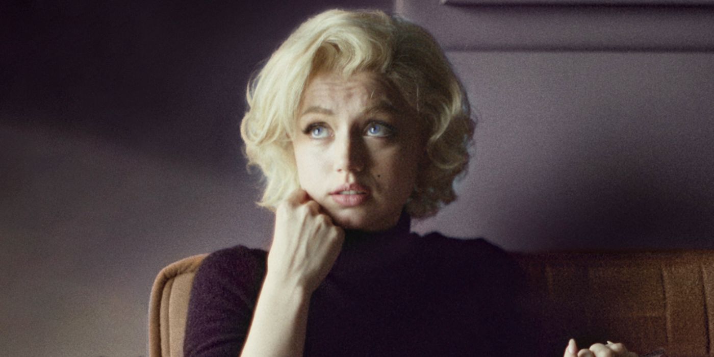 Marilyn Monroe looking up with a confused expression on her face in Blonde.