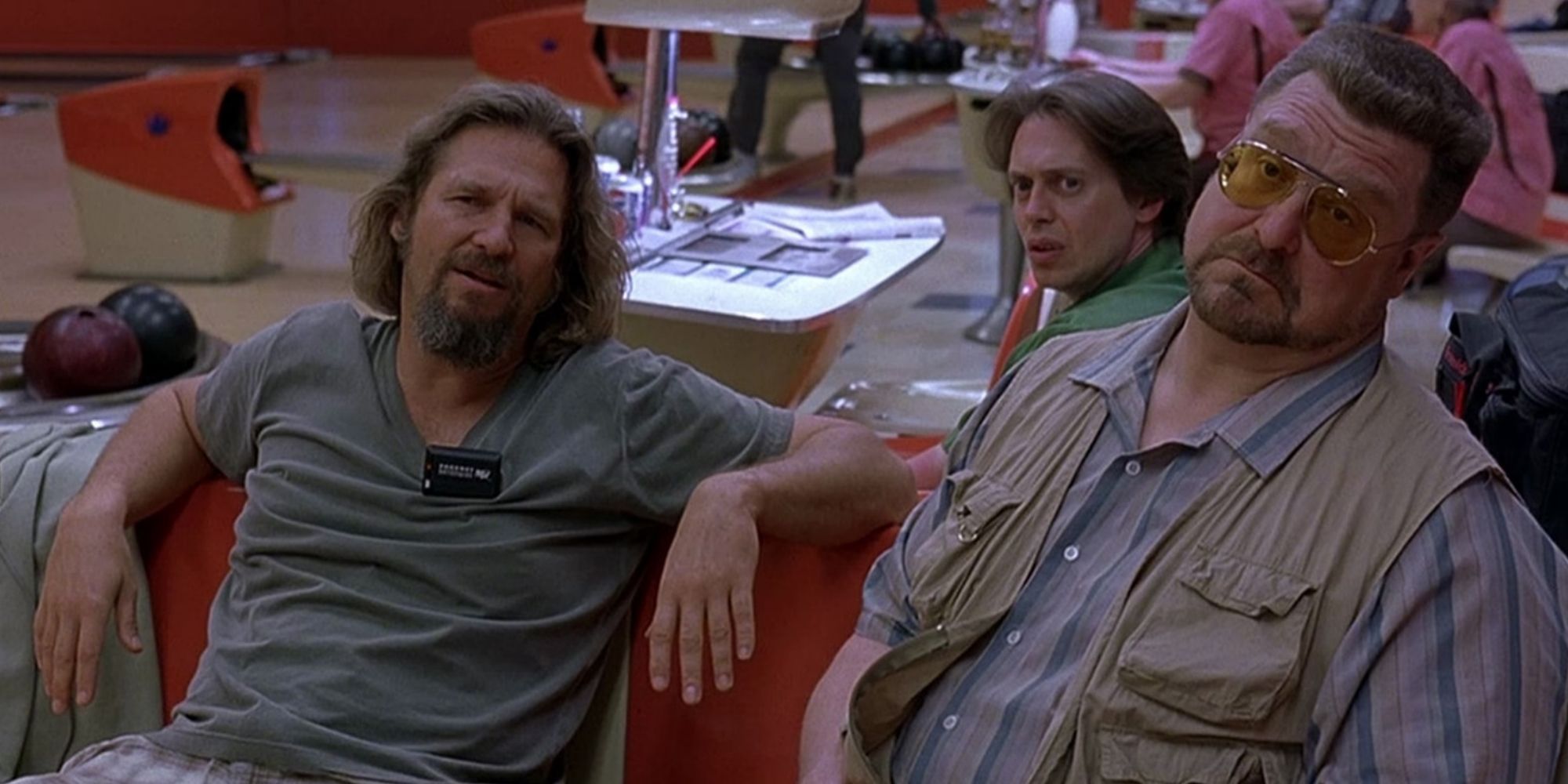 The Dude, Walter and Donny sitting in a bowling alley in 'The Big Lebowski' (1998)