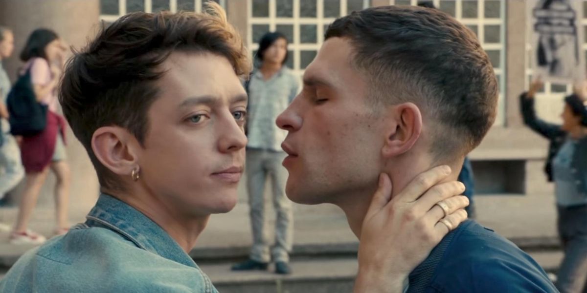 A man aiming for a kiss while another turns away in the film BPM.