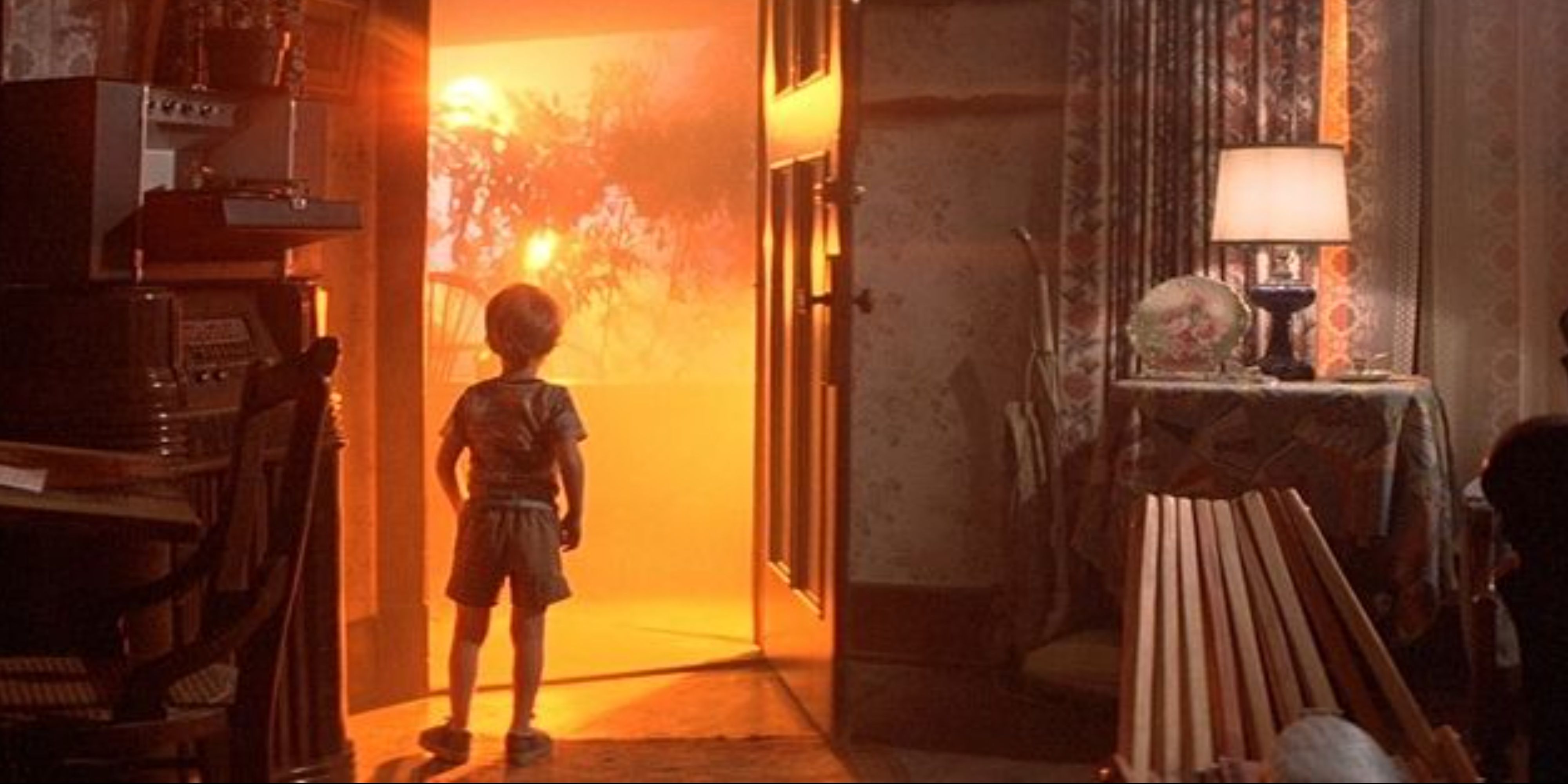 A young boy facing a bright light in the film Close Encounters of the Third Kind