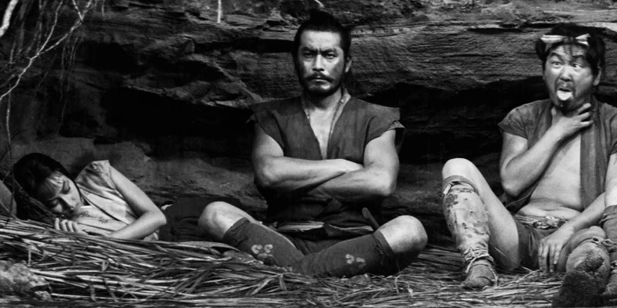 Misa Uehara, Toshiro Mifune, and Minoru Chiaki sitting or laying down in The Hidden Fortress
