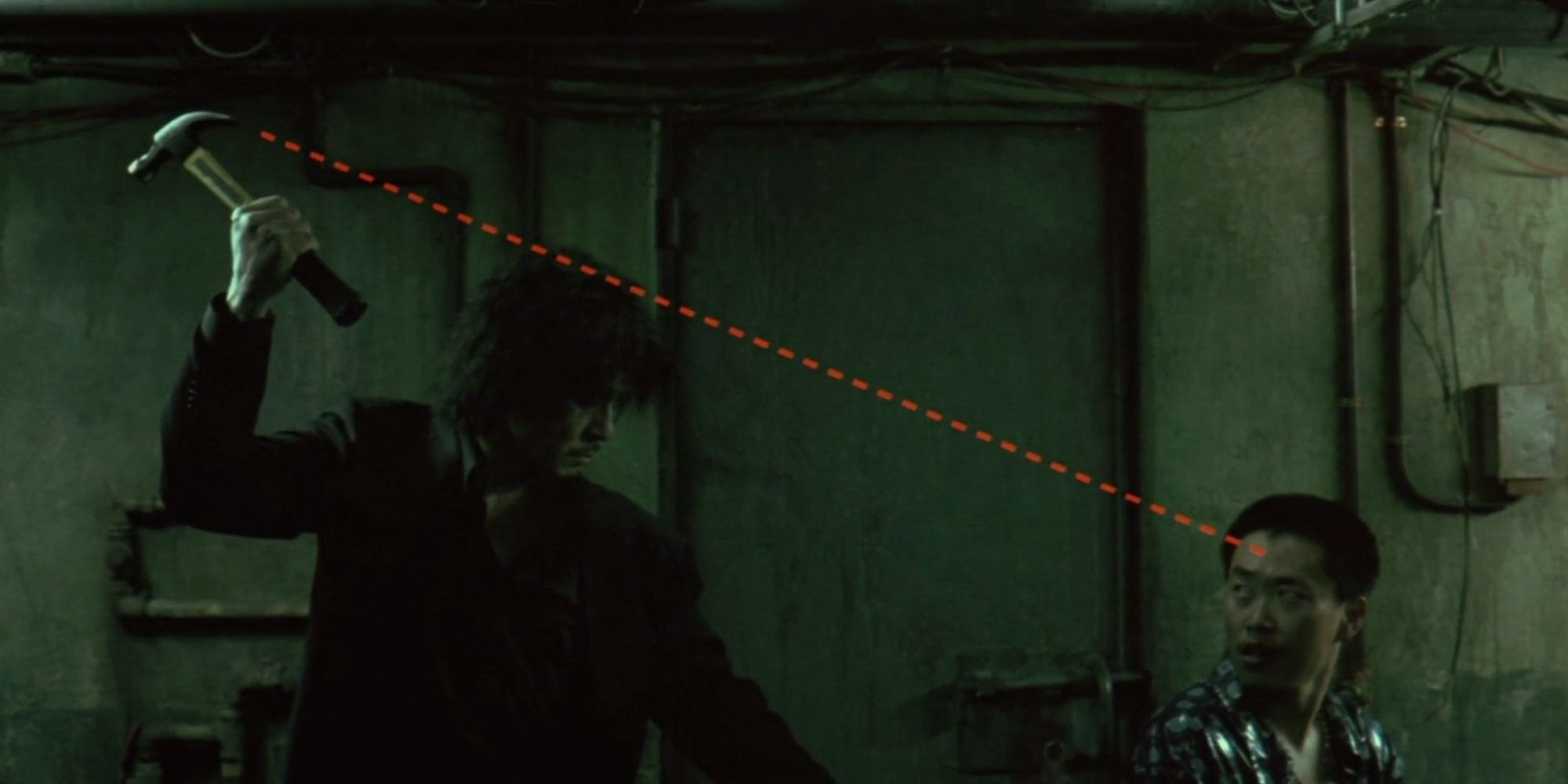 Choi Min-sik as Oh Dae-su about to hit a man with a hammer, a red dotted line pointing the trajectory, in 'Oldboy' 