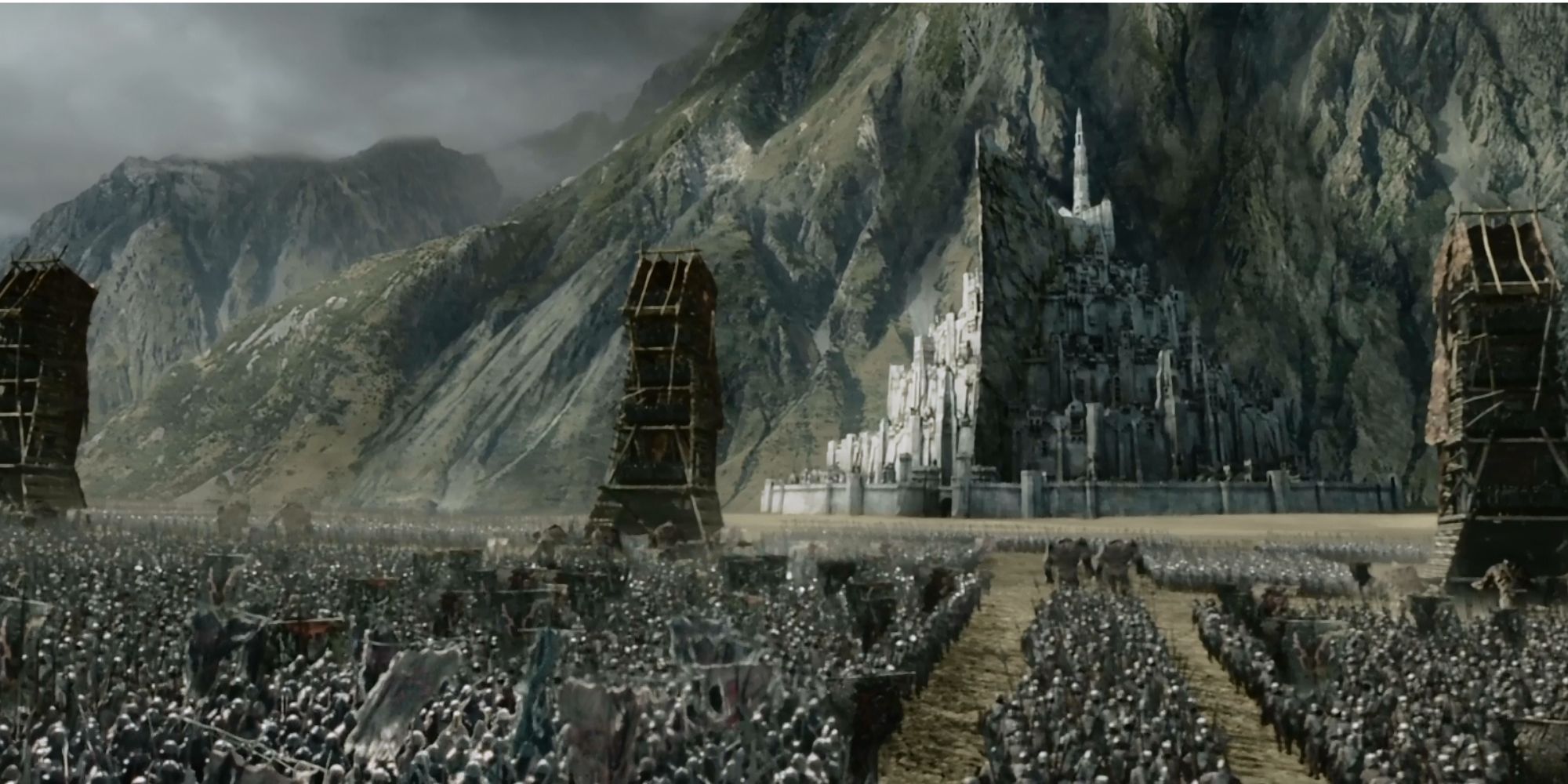 Siege towers, along with an army of orcs moves closer to Minas Tirith