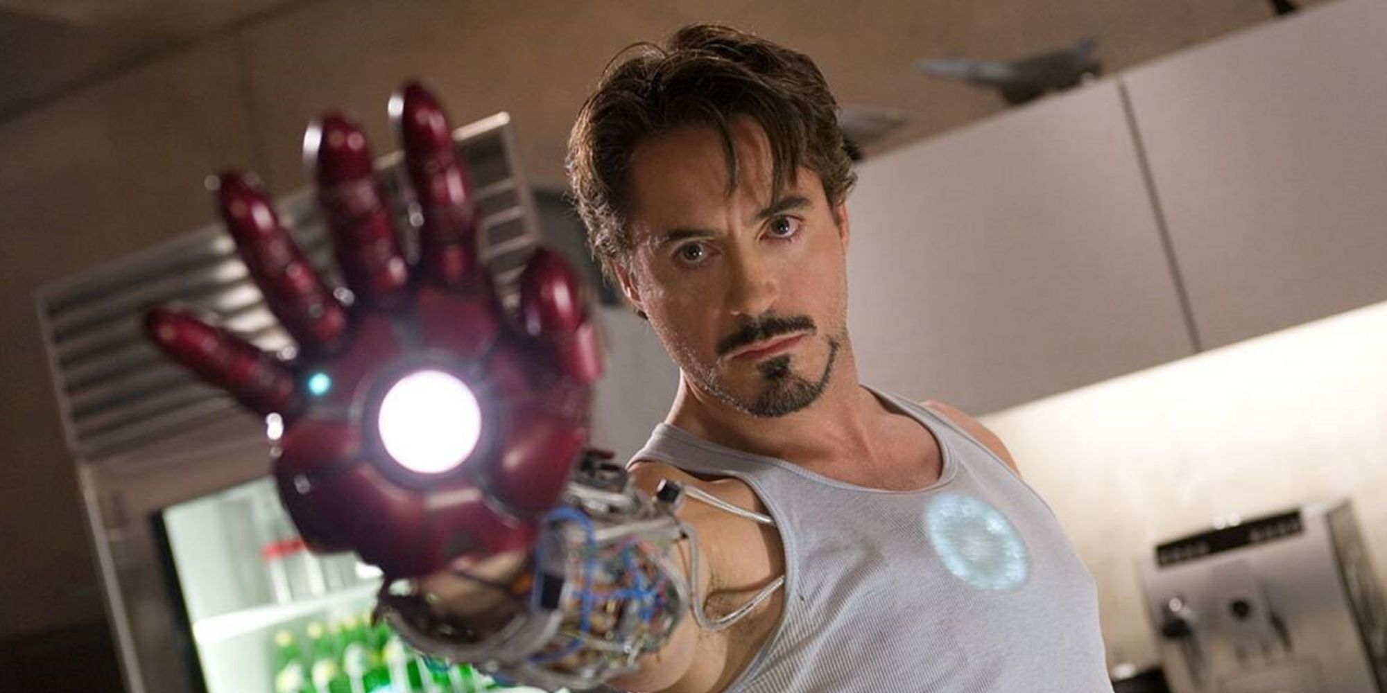Tony Stark (Robert Downey Jr.) aims a repulsor blast in 'Iron Man' (2008)