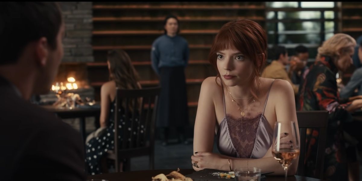 Anya Taylor-Joy as Margot Mills eating dinner in 'The Menu'