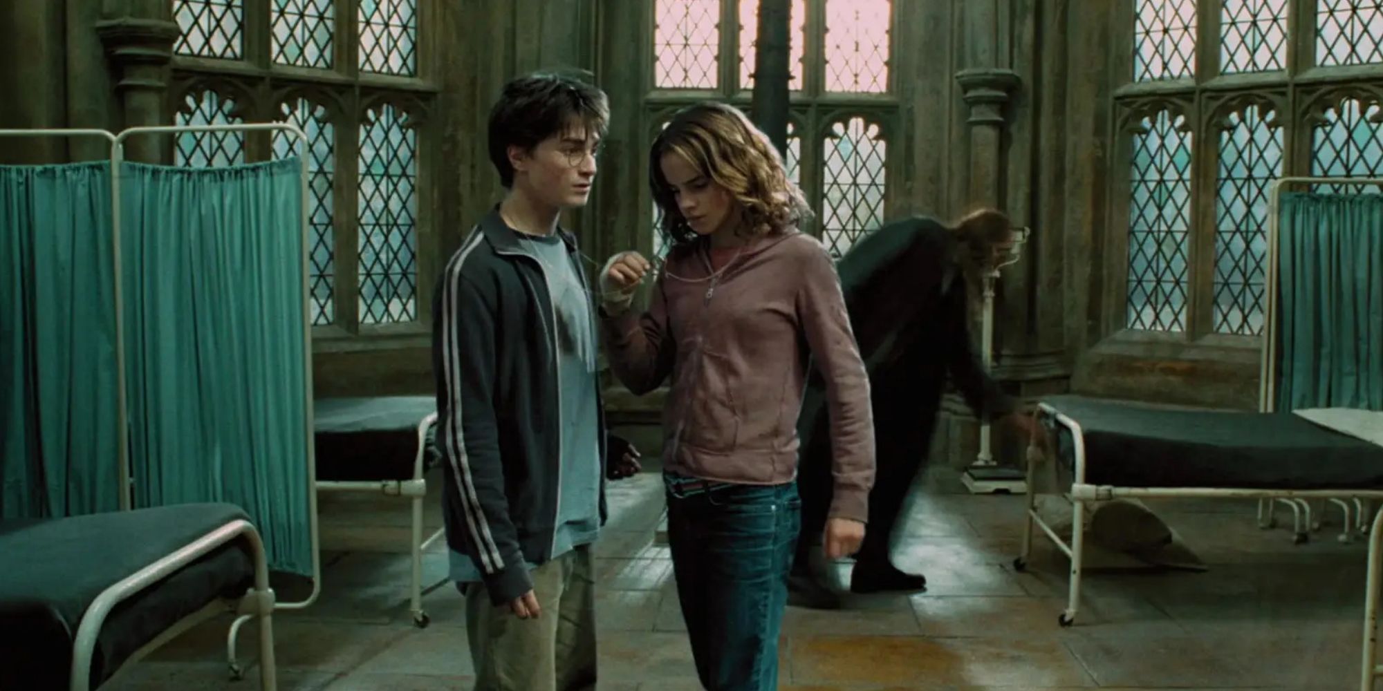 Harry (Daniel Radcliffe) and Hermione (Emma Watson) use the time turner in Harry Potter and the Prisoner of Azkaban