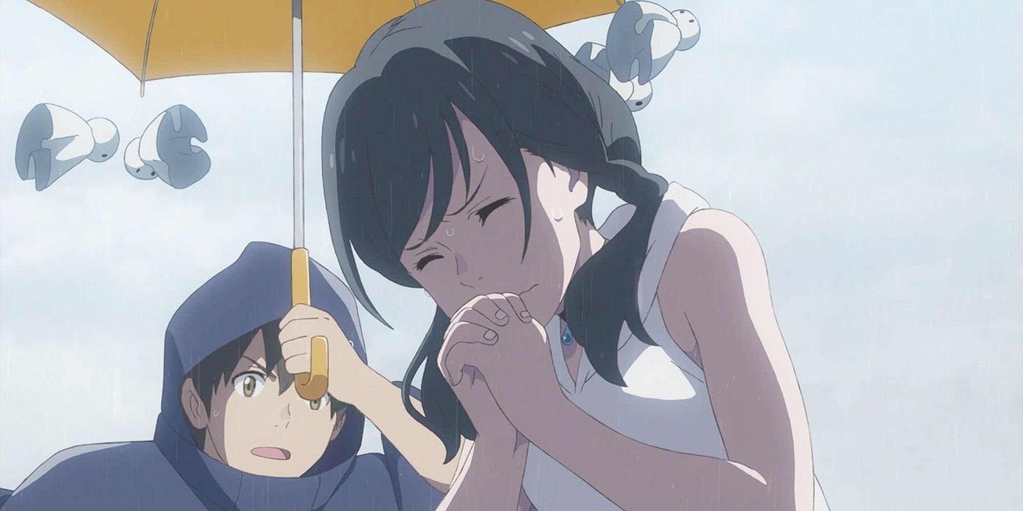 Hina praying while Hodaka holds an umbrella over her.