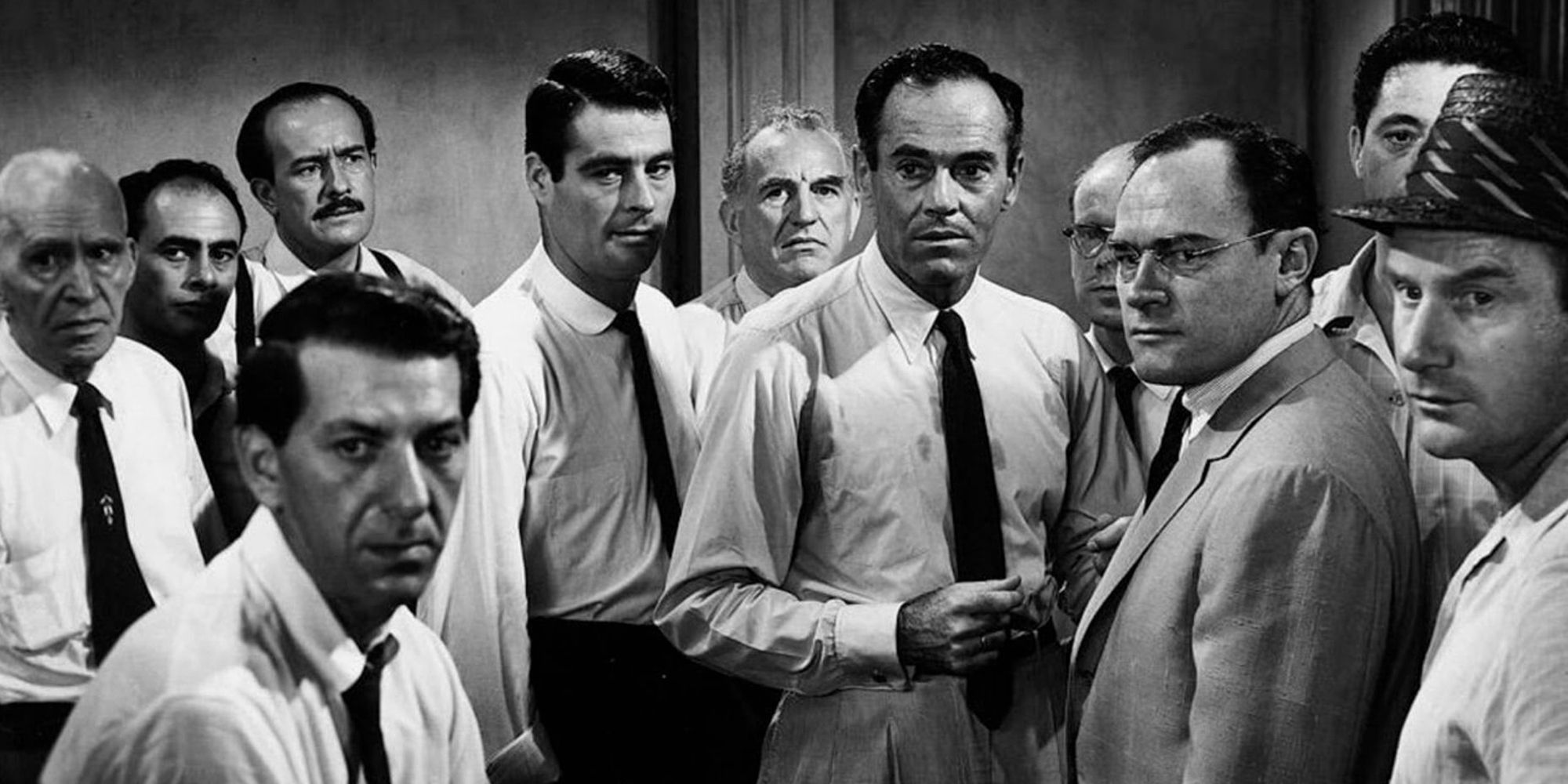 Henry Fonda and the cast of 12 Angry Men looking directly at the camera.