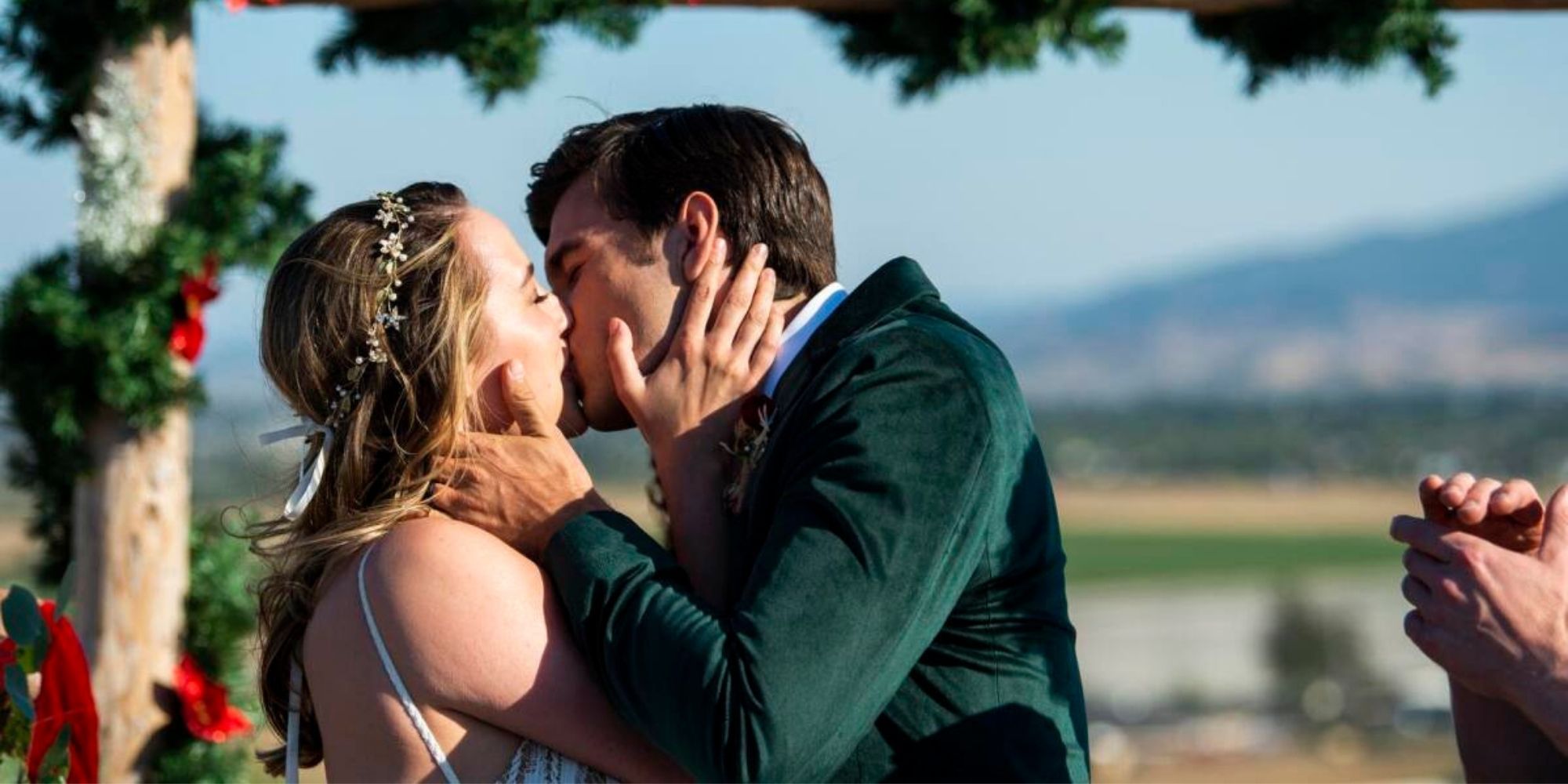Callie and Joseph from A California Christmas kissing at their wedding