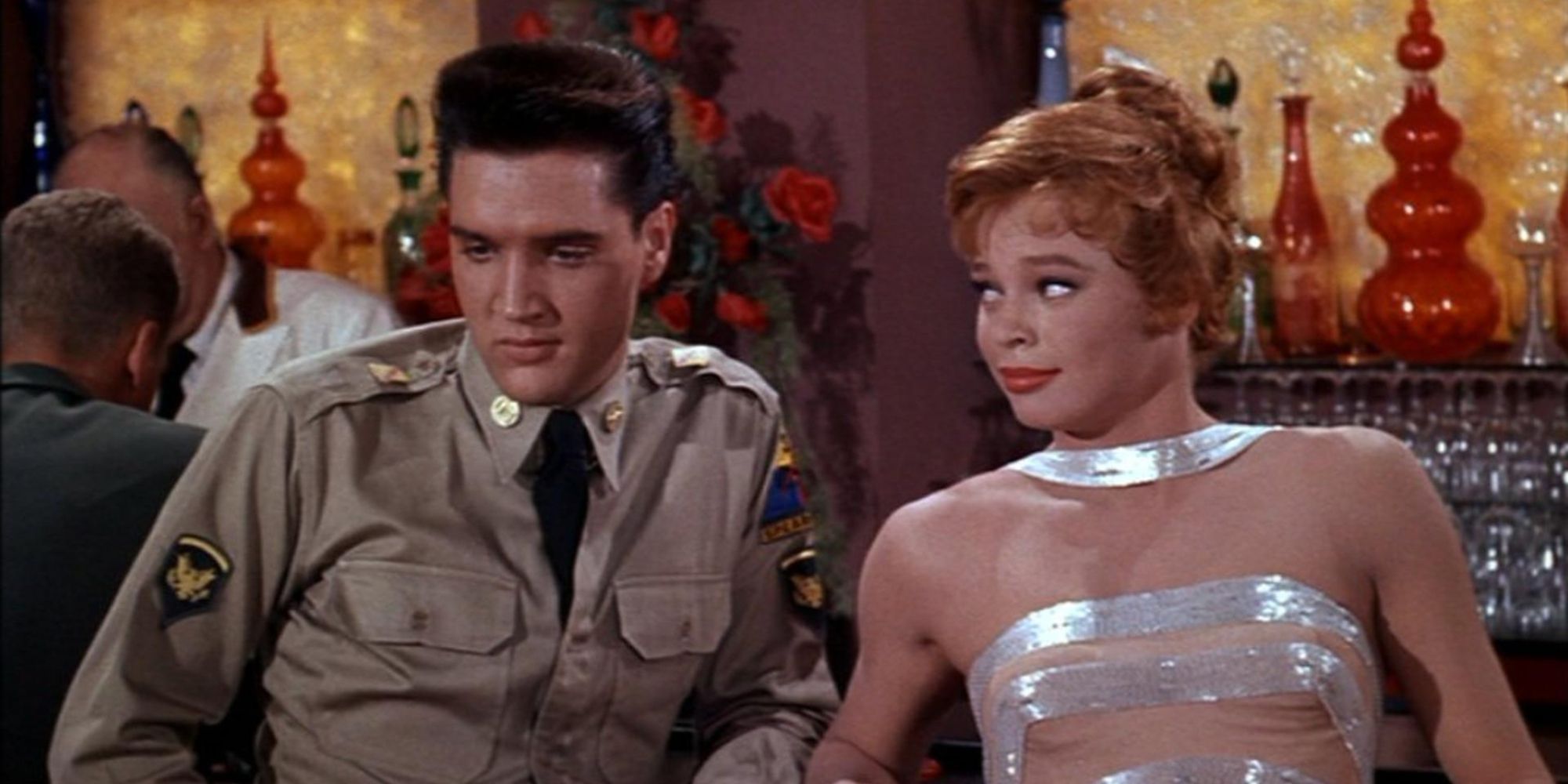 Elvis Presley and Juliet Prowse sitting at the bar 