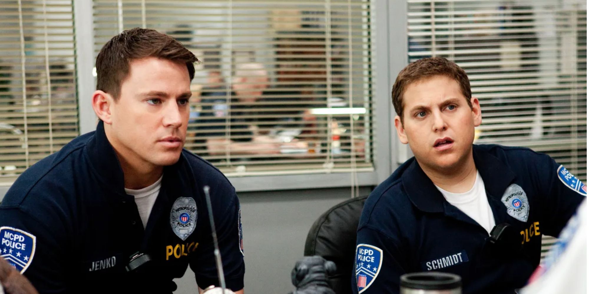 Channing Tatum and Jonah Hill staring at their Captain confused in 21 Jump Street