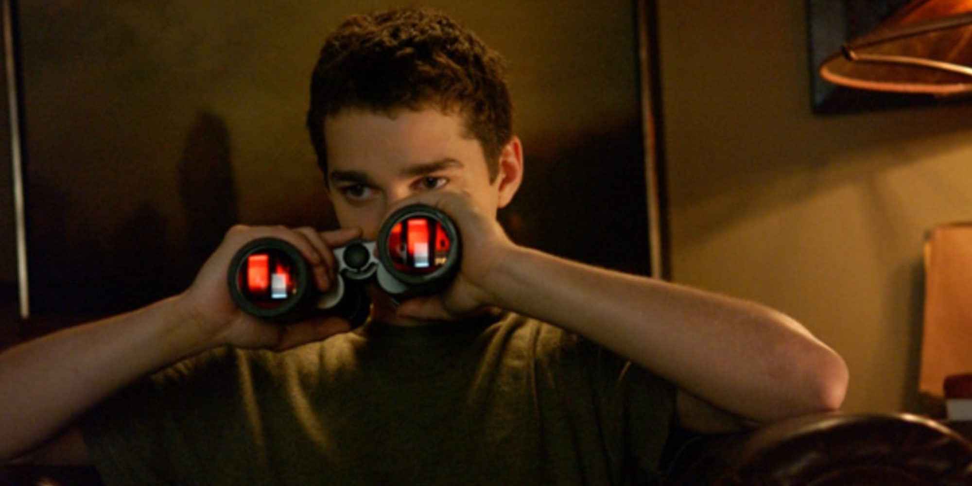 Shia LaBeouf as Kale using a pair of binoculars in 'Disturbia'