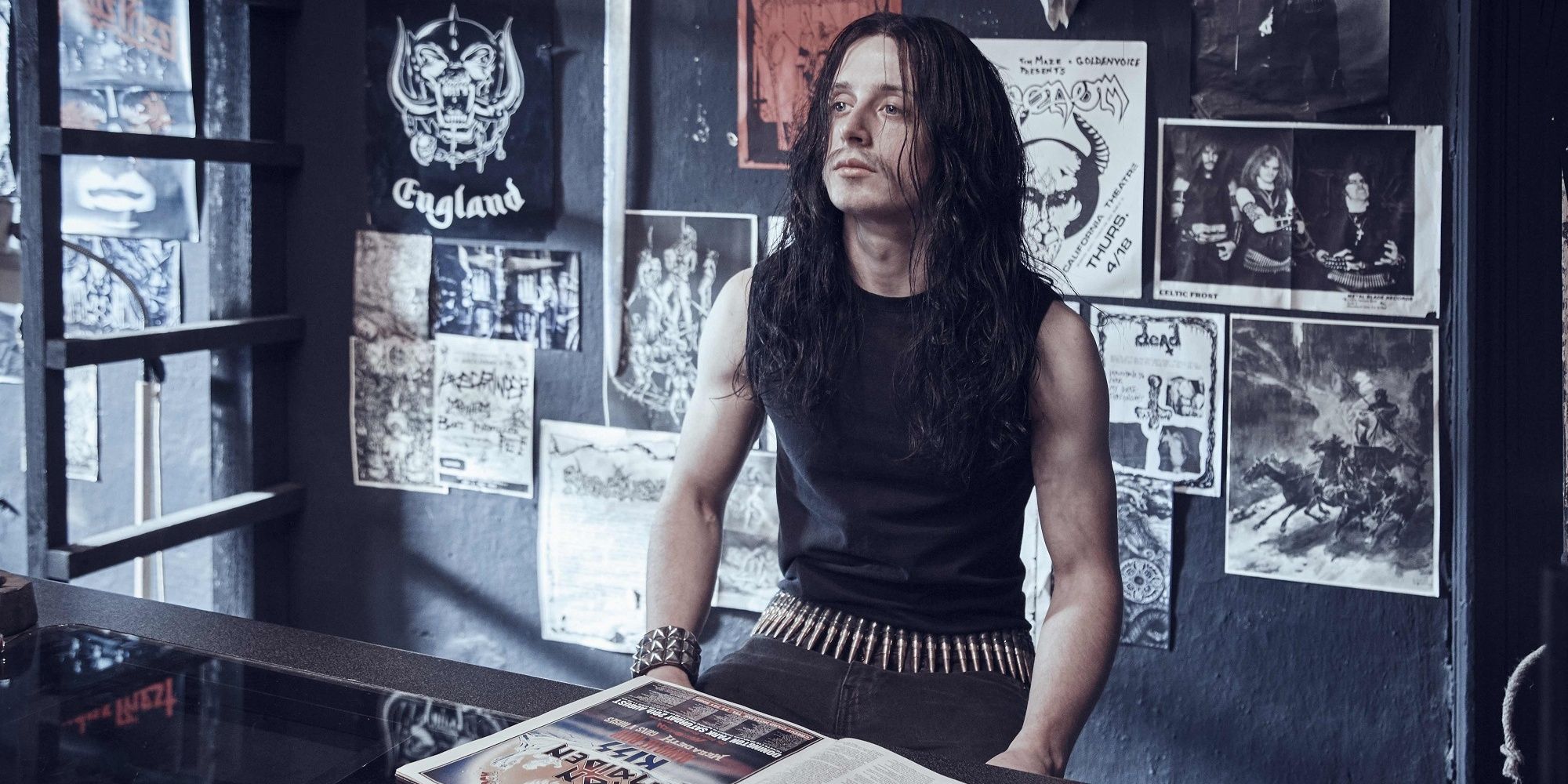 Euronymous sitting at his record store in Lords of Chaos.