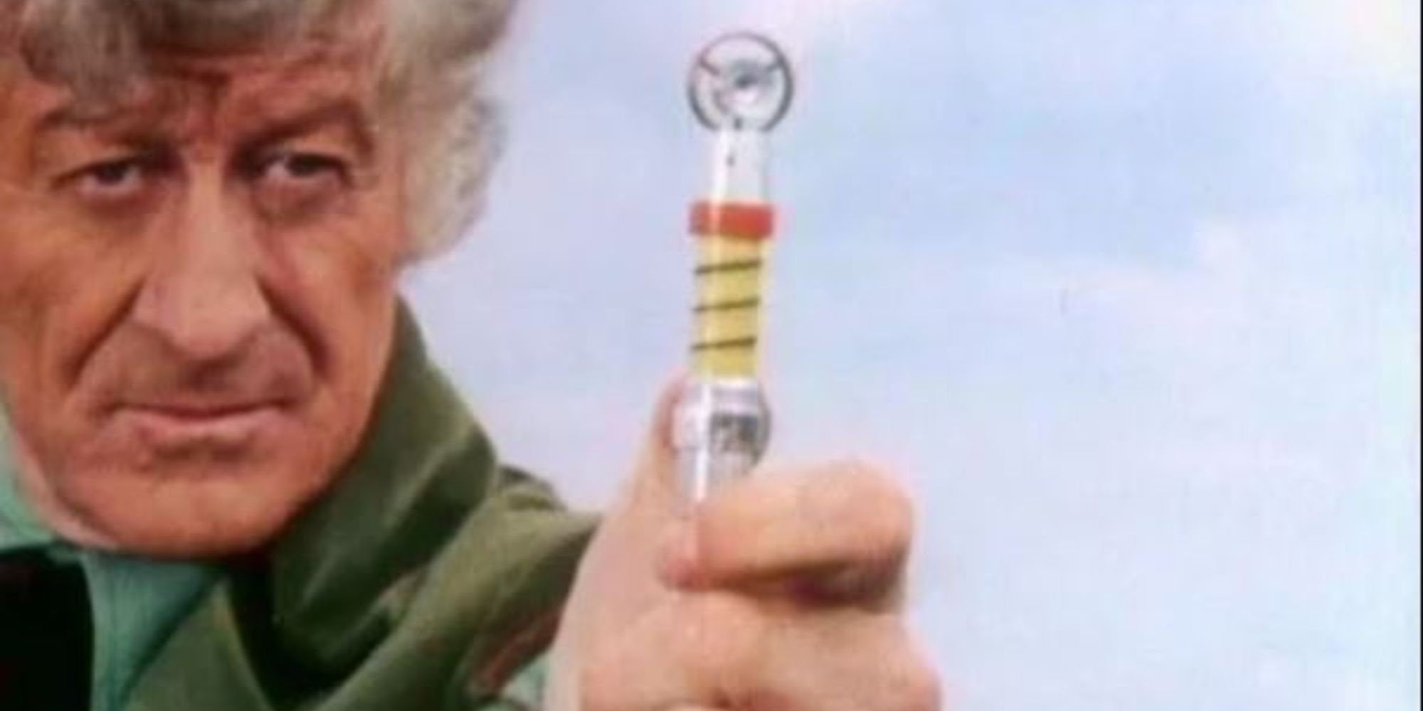 3rd Doctor holding a sonic screwdriver at the screen