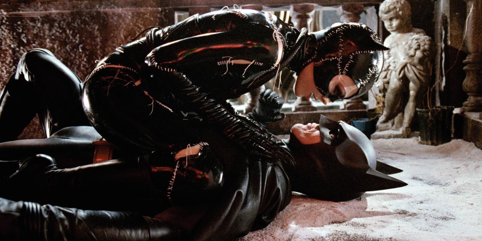 Catwoman on top of Batman in Batman Returns