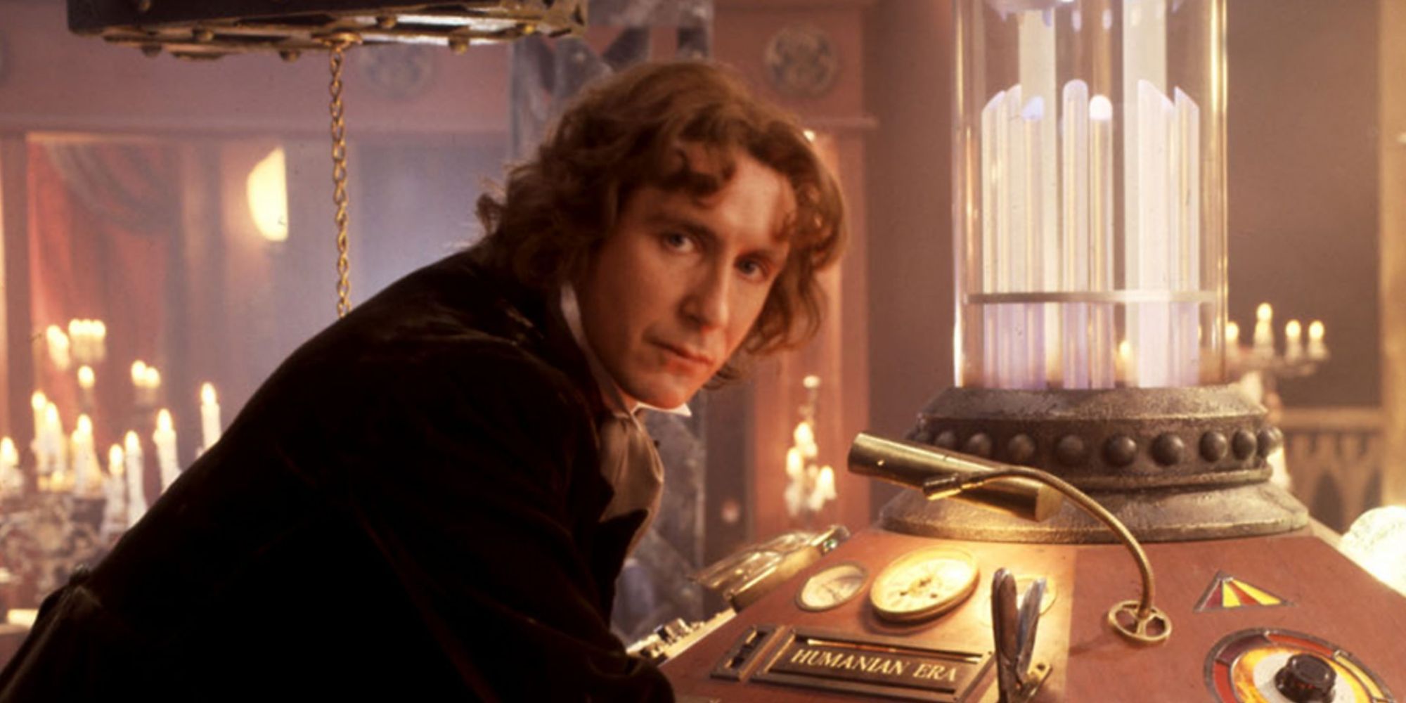 8th Doctor leaning against his TARDIS console
