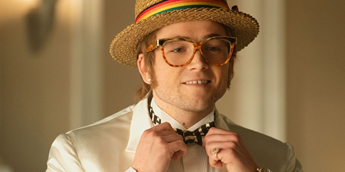 Elton John straightens his bow tie in Rocketman