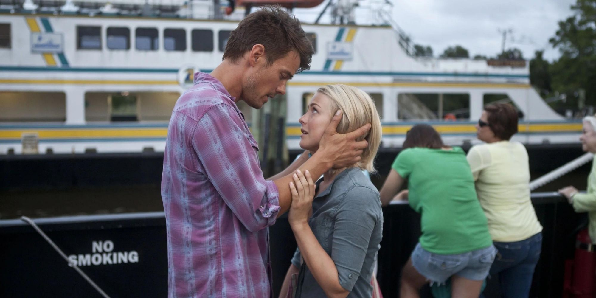 Alex and Katie from Safe Haven standing in front of a ship