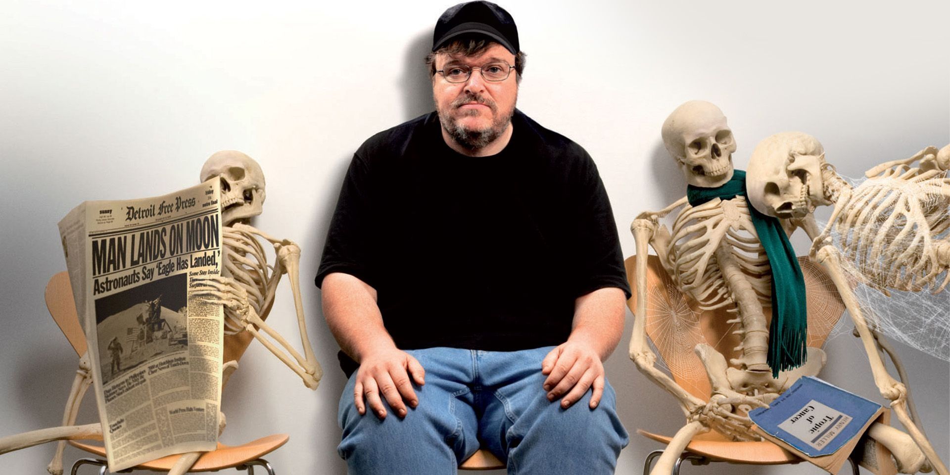 Sicko, Michael Moore, Moore Sitting in waiting room with skeletons