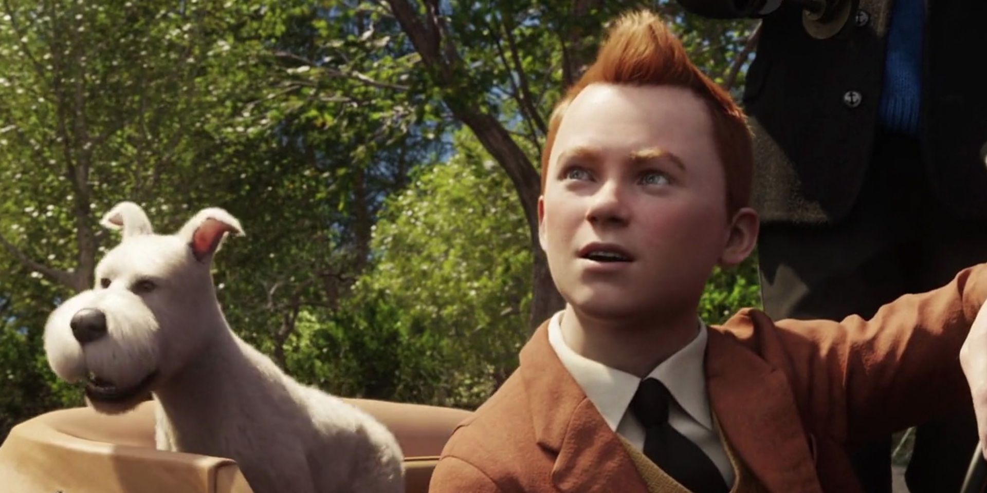 Tintin (Jaime Bell) and a white dog in 'The Adventures of Tintin'
