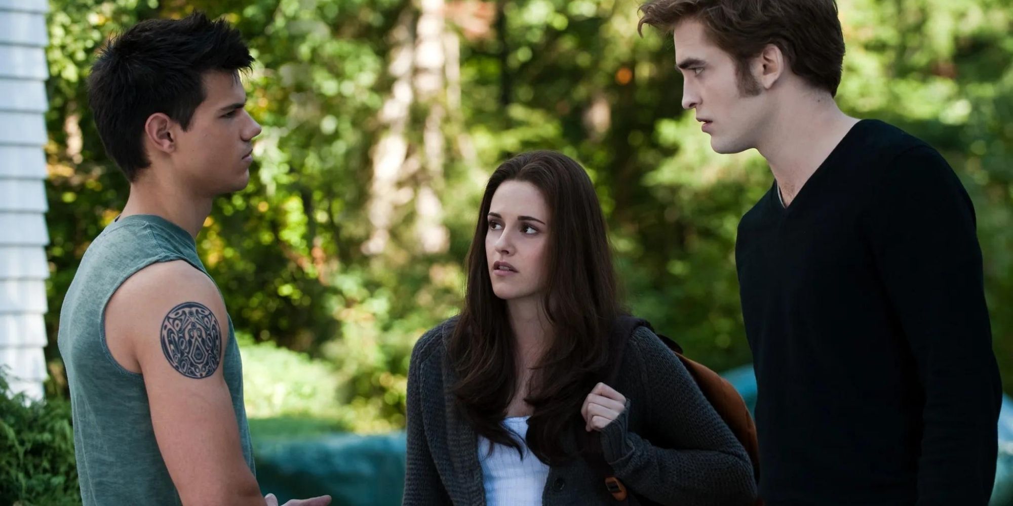 Jacob, Bella, and Edward from The Twilight Saga standing together