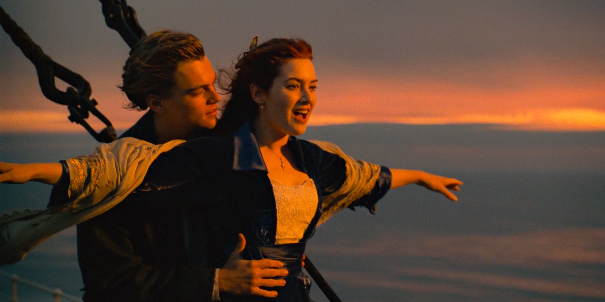 Jack (Leonardo DiCaprio) and Rose (Kate Winslet) with arms outstretched on the bow of the ship in Titanic