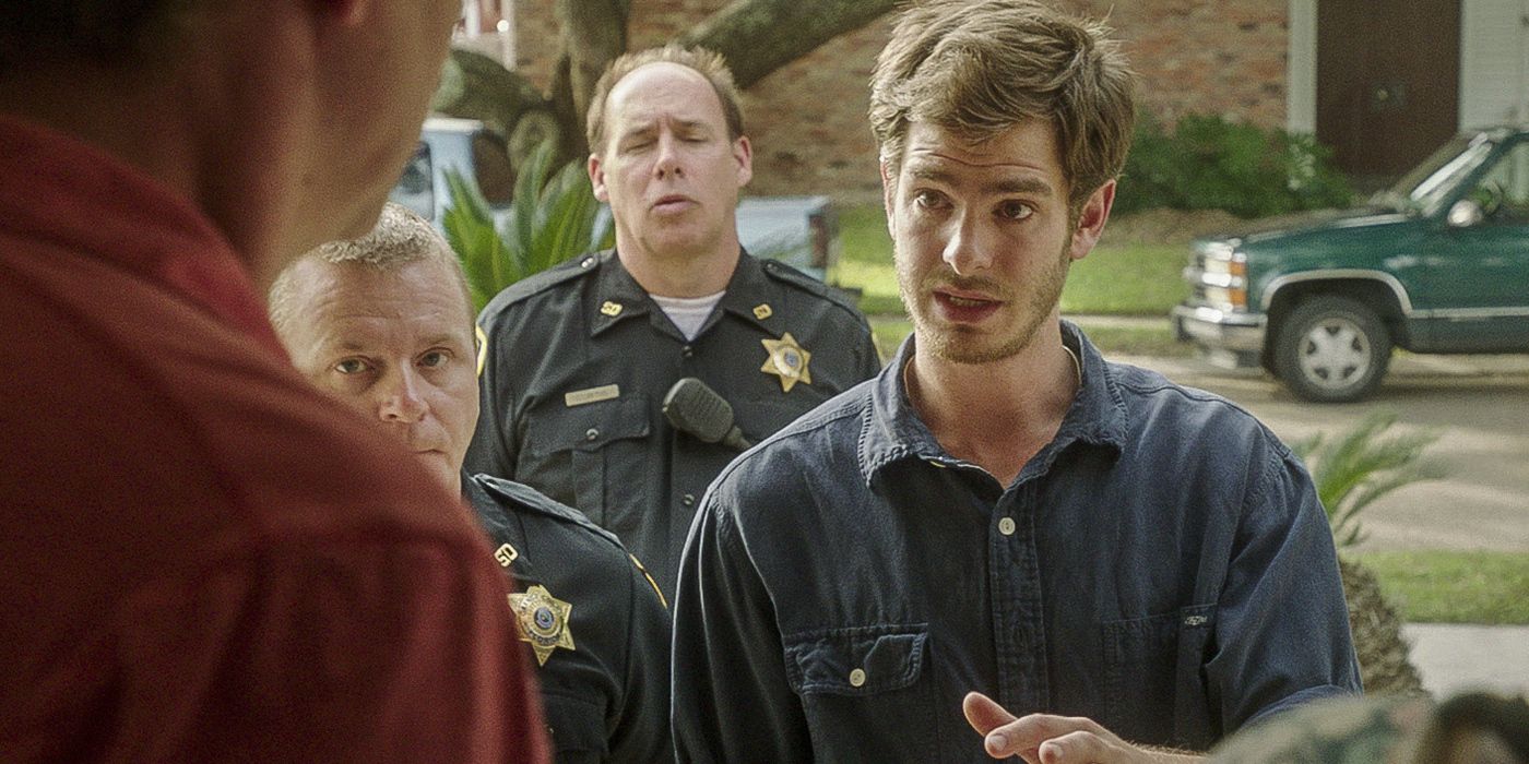 Dennis Nash talking to people inside a house in the film 99 Homes.