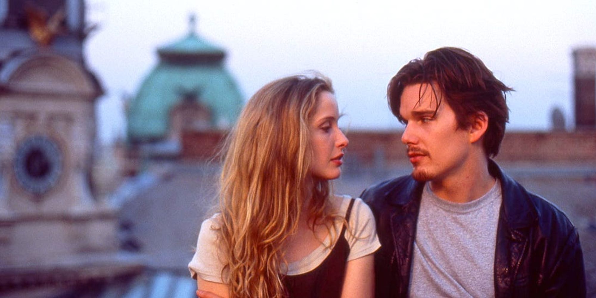 Celine and Jesse embracing and looking into each other's eyes in Before Sunrise