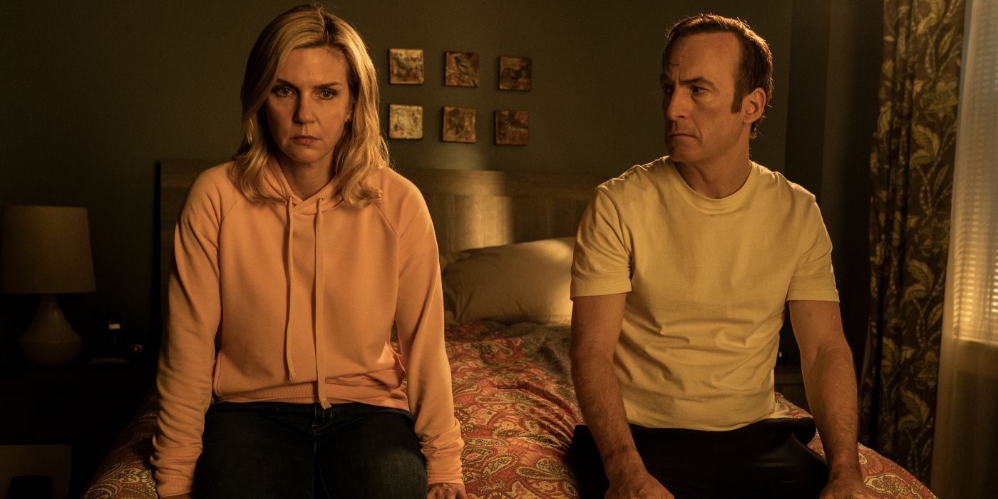 Jimmy McGill (Bob Odenkirk) and Kim Wexler (Rhea Seehorn) sitting on their bed looking serious and upset in Better Call Saul Season 6 Episode 8