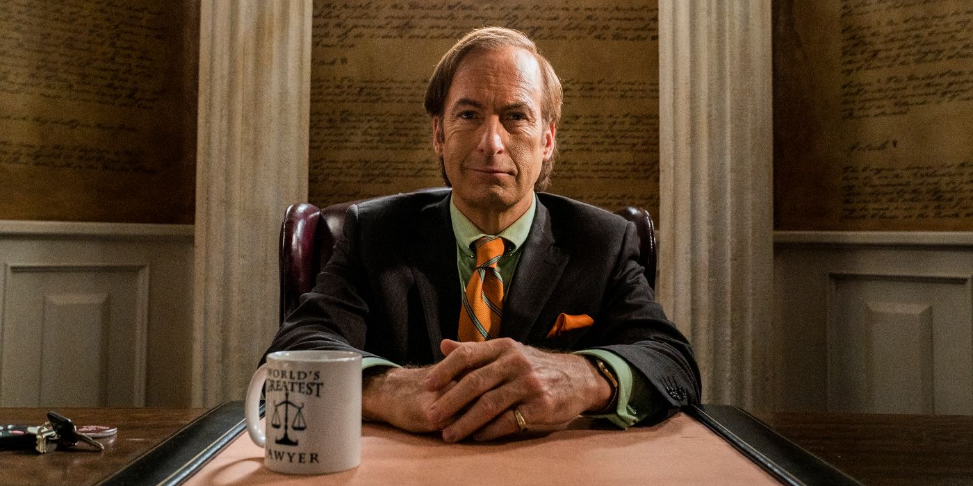 Saul (Bob Odenkirk) sitting at his desk with his "World's Greatest Lawyer" cup next to him in Better Call Saul Season 6 Episode 9 