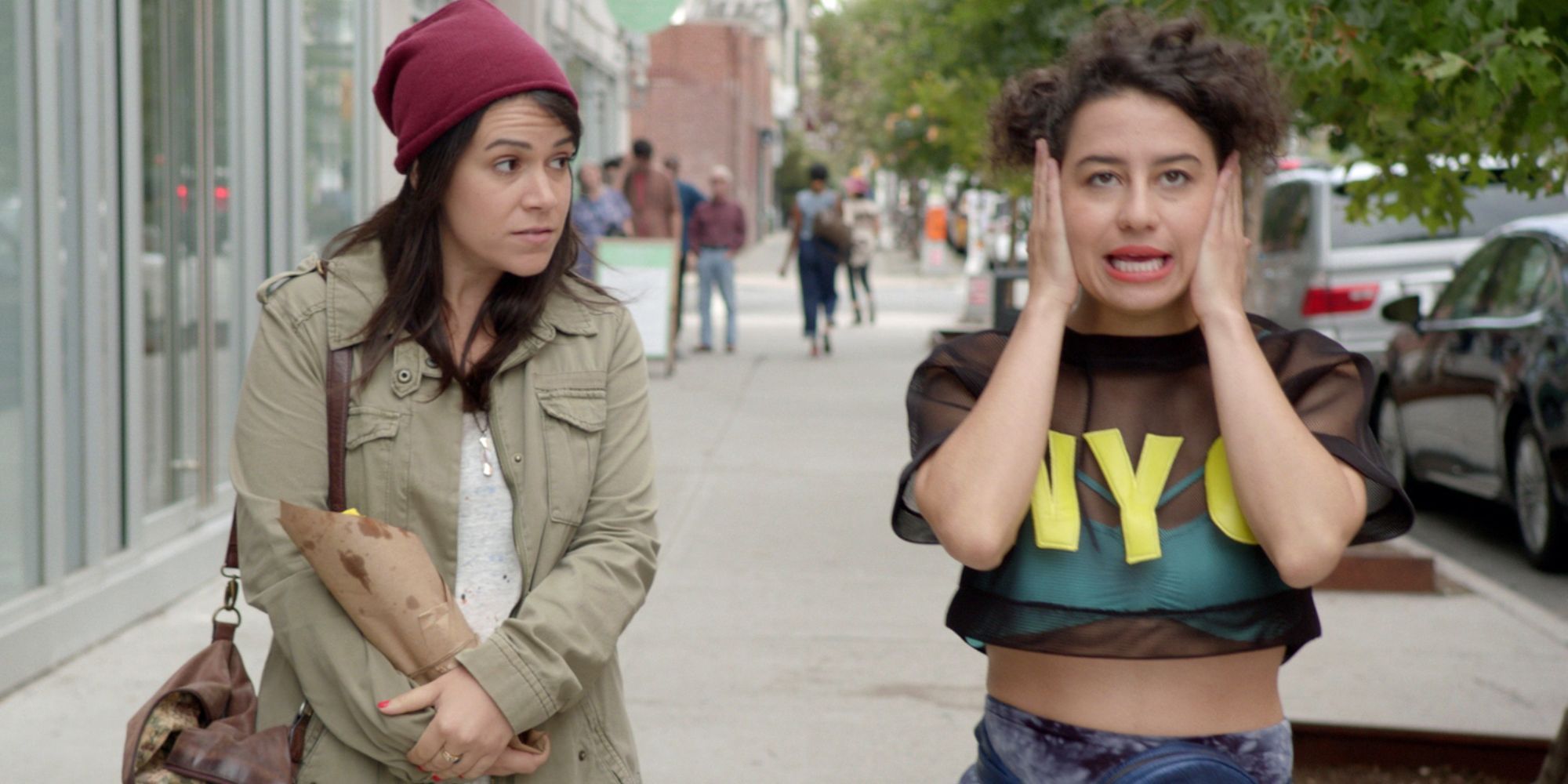 Abbi and Ilana walking down the street in Broad City.
