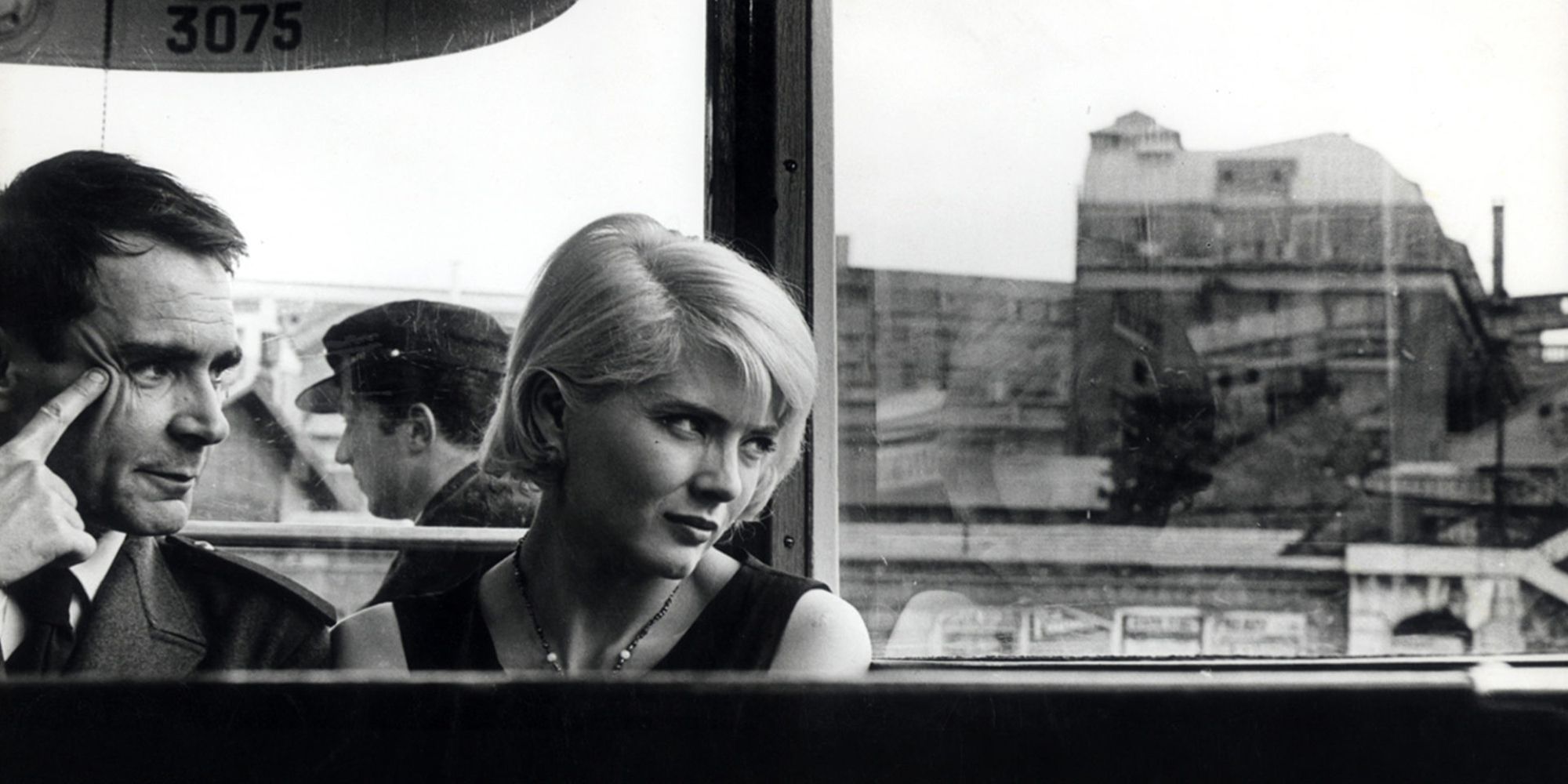 Corinne Marchand glancing out a window in 'Cleo from 5 to 7'